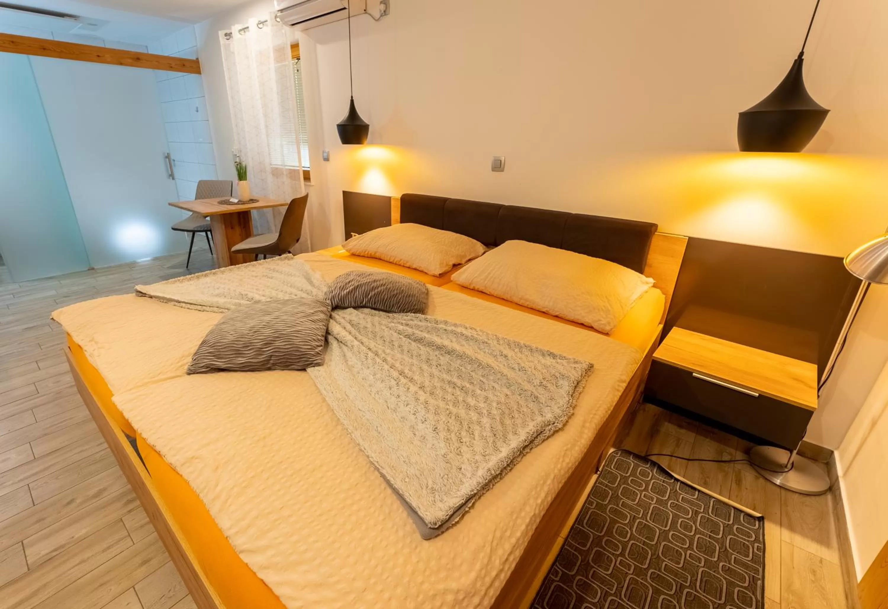 Bed in Korošec Apartments and Wellness Centre