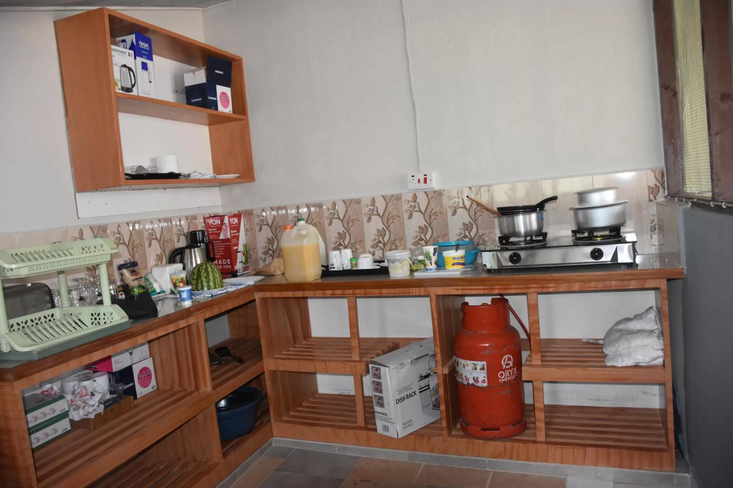 Kitchen or kitchenette in L&J Modern Backpackers Kinondoni