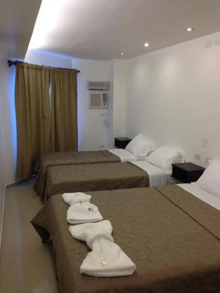 Photo of the whole room, Bed in Lorenzo Suites Hotel