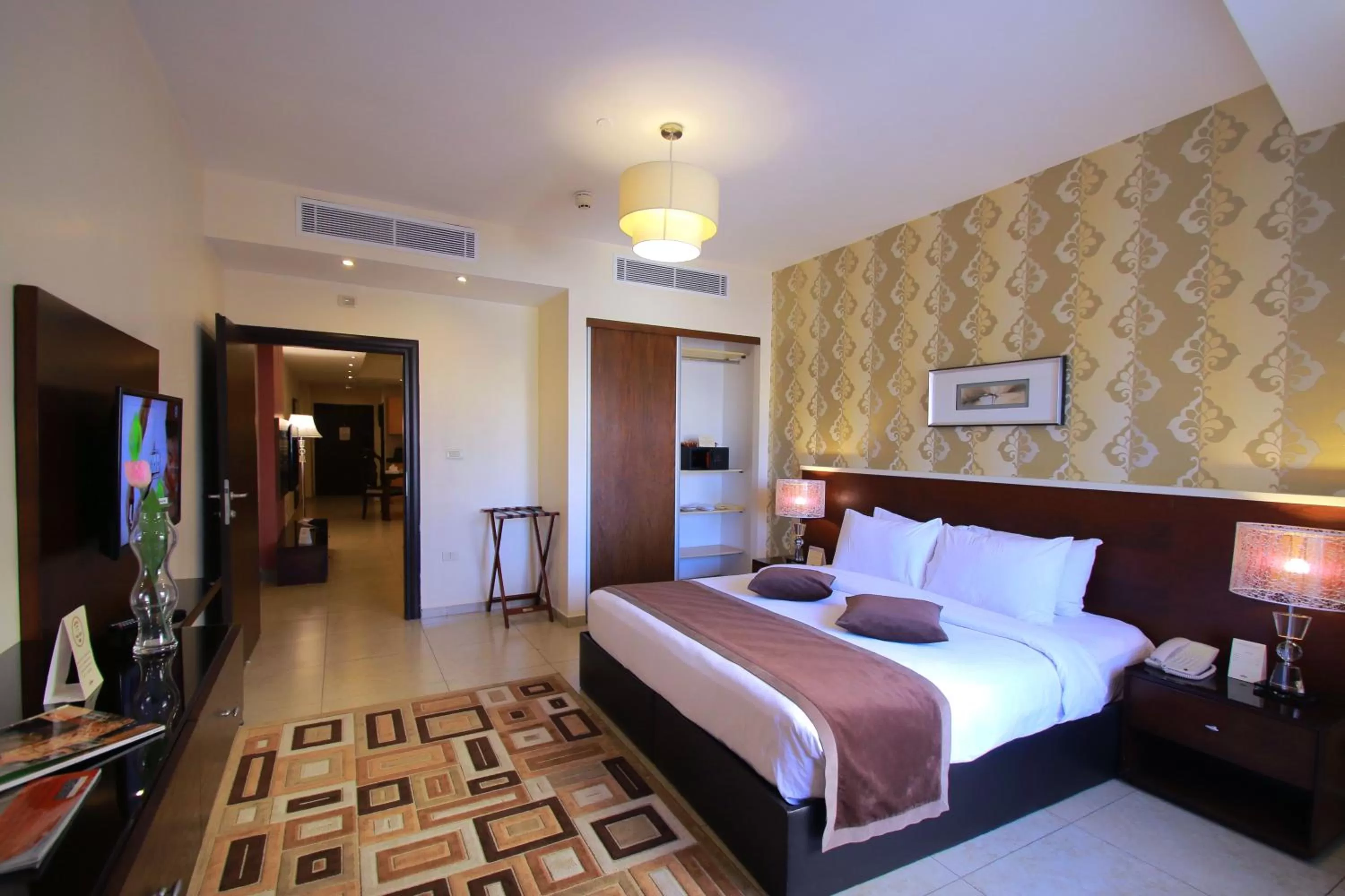 Bed in City Rose Hotel Suites