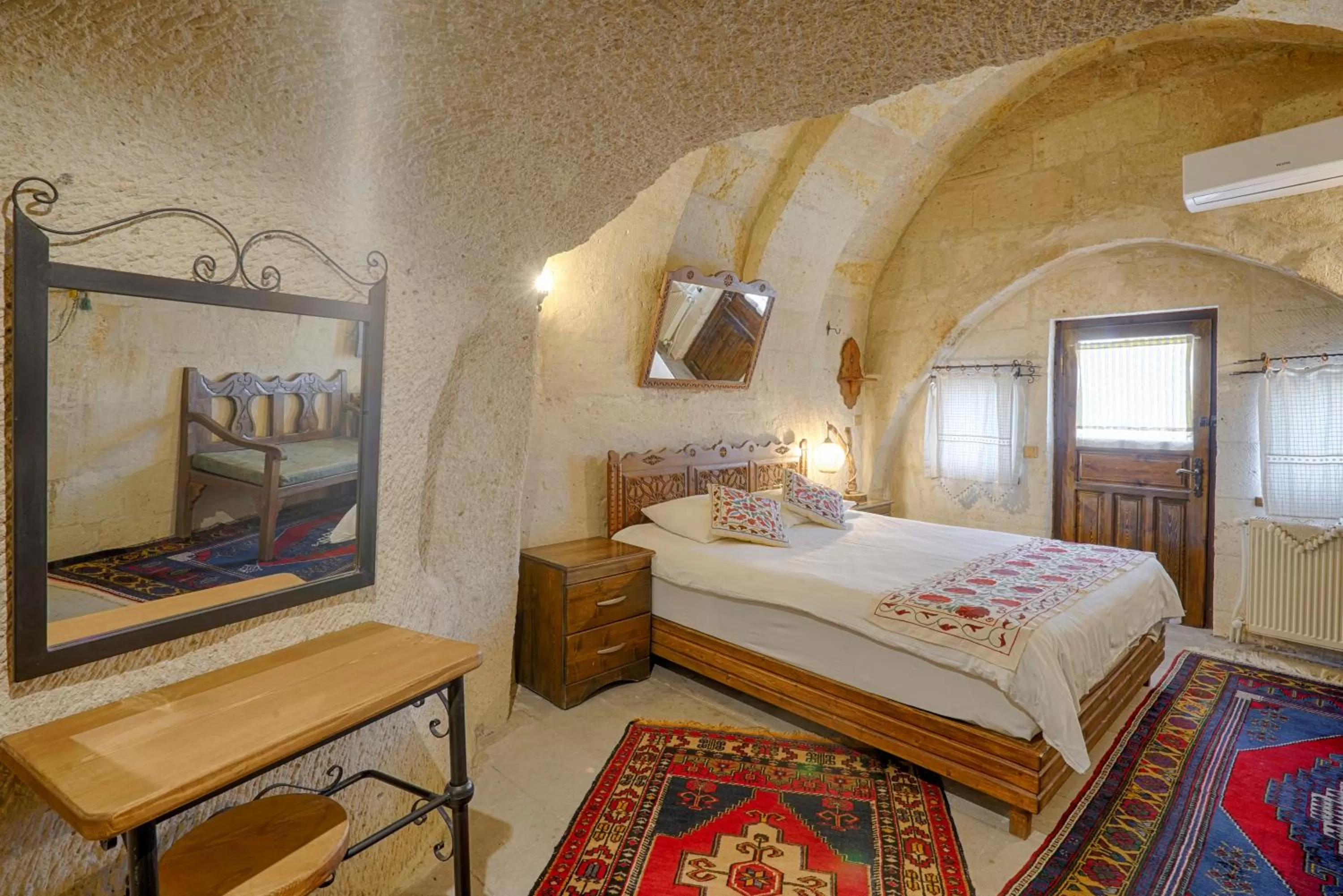 Bed in Tulip Cave Suites