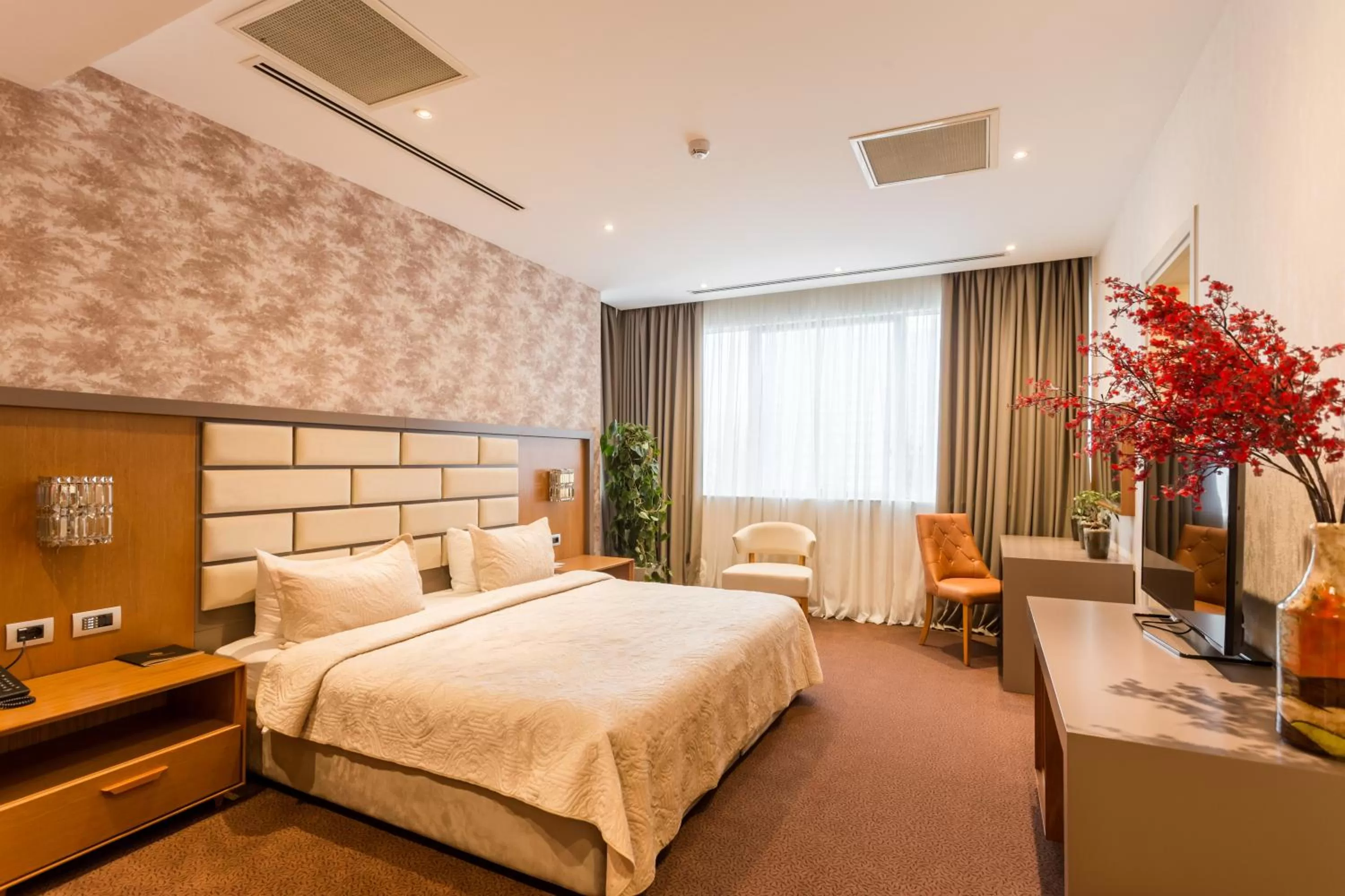 Bed in The Grand Gloria Hotel