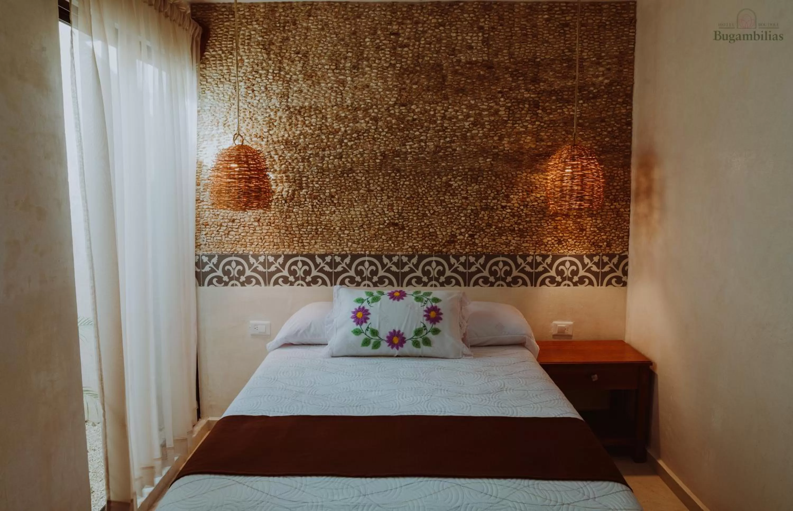 Bed in Hotel Boutique Bugambilias