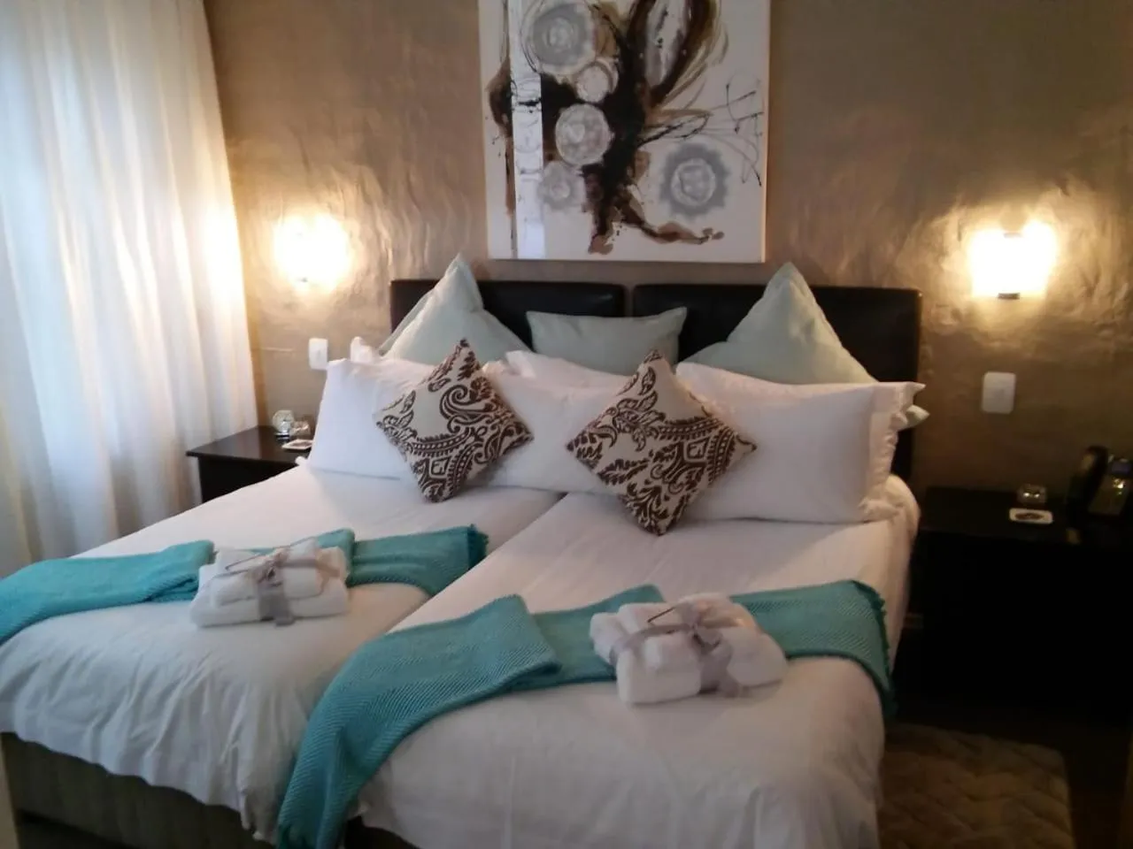 Bed in Point B Guest House -Sustainable Solar Energy