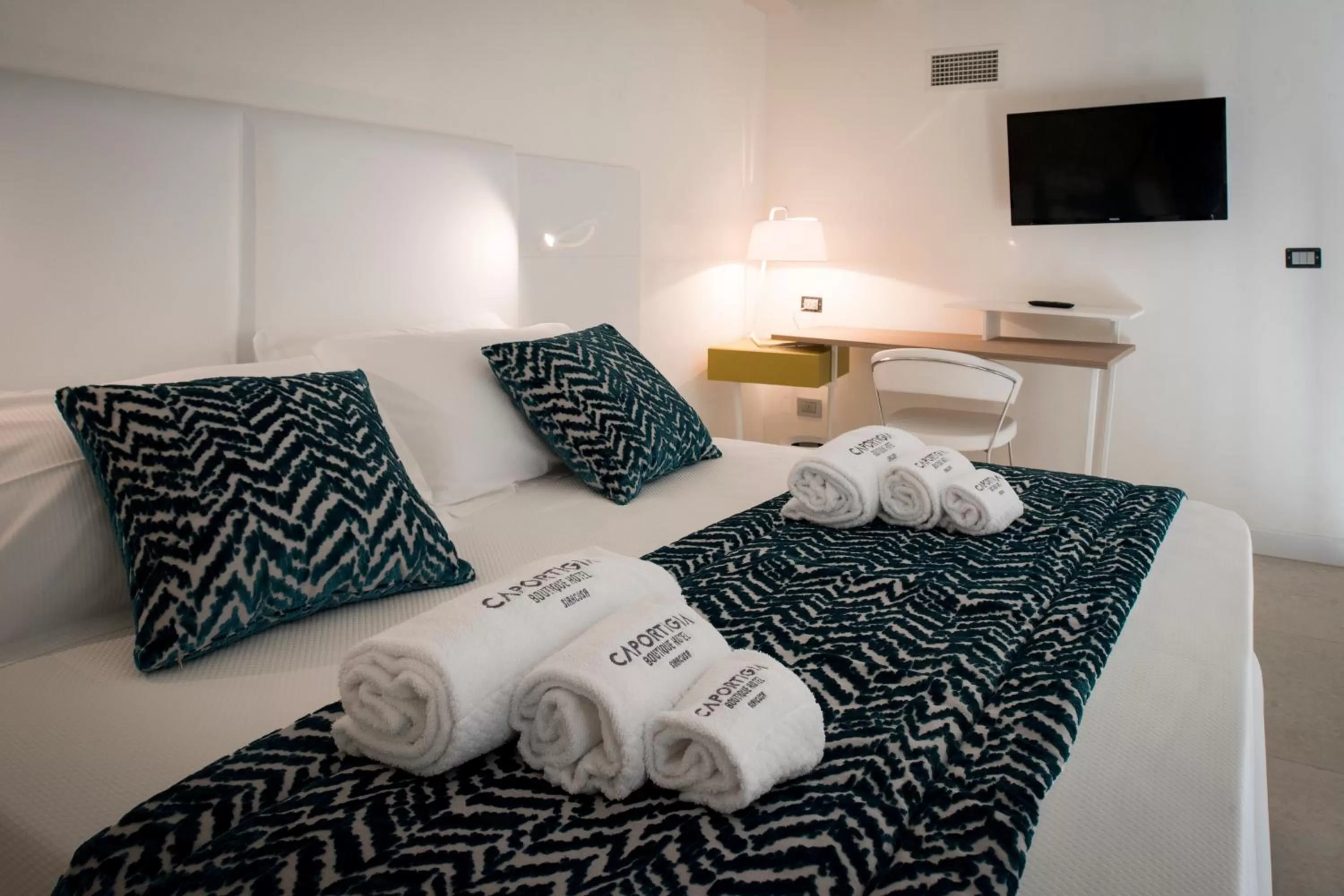 Bed in Caportigia Boutique Hotel