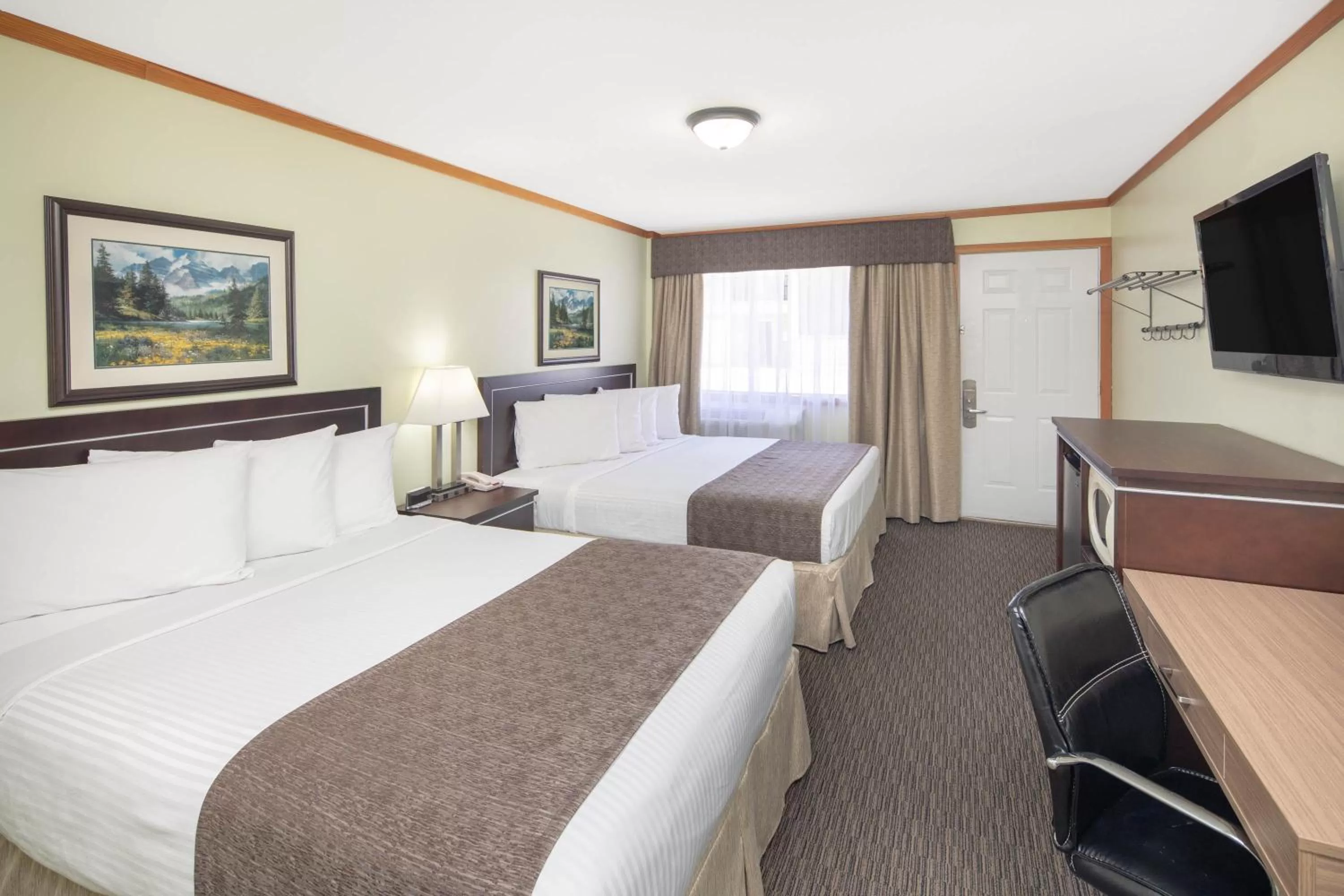 Studio Suite - Two Queen Beds with Kitchen - Non-Smoking - Ground Floor in Travelodge by Wyndham Golden Sportsman Lodge