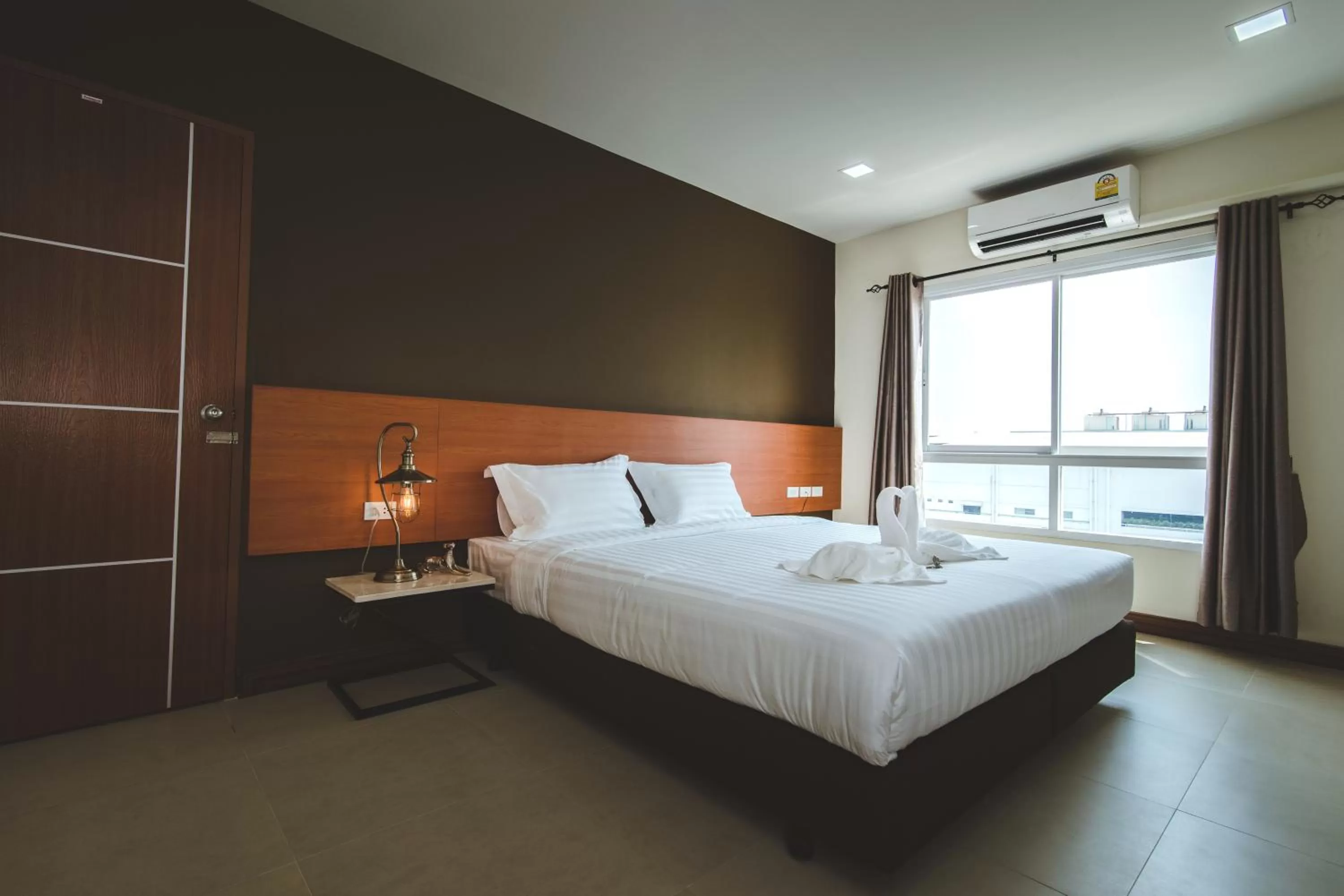 Bed in deVloft hotel Korat