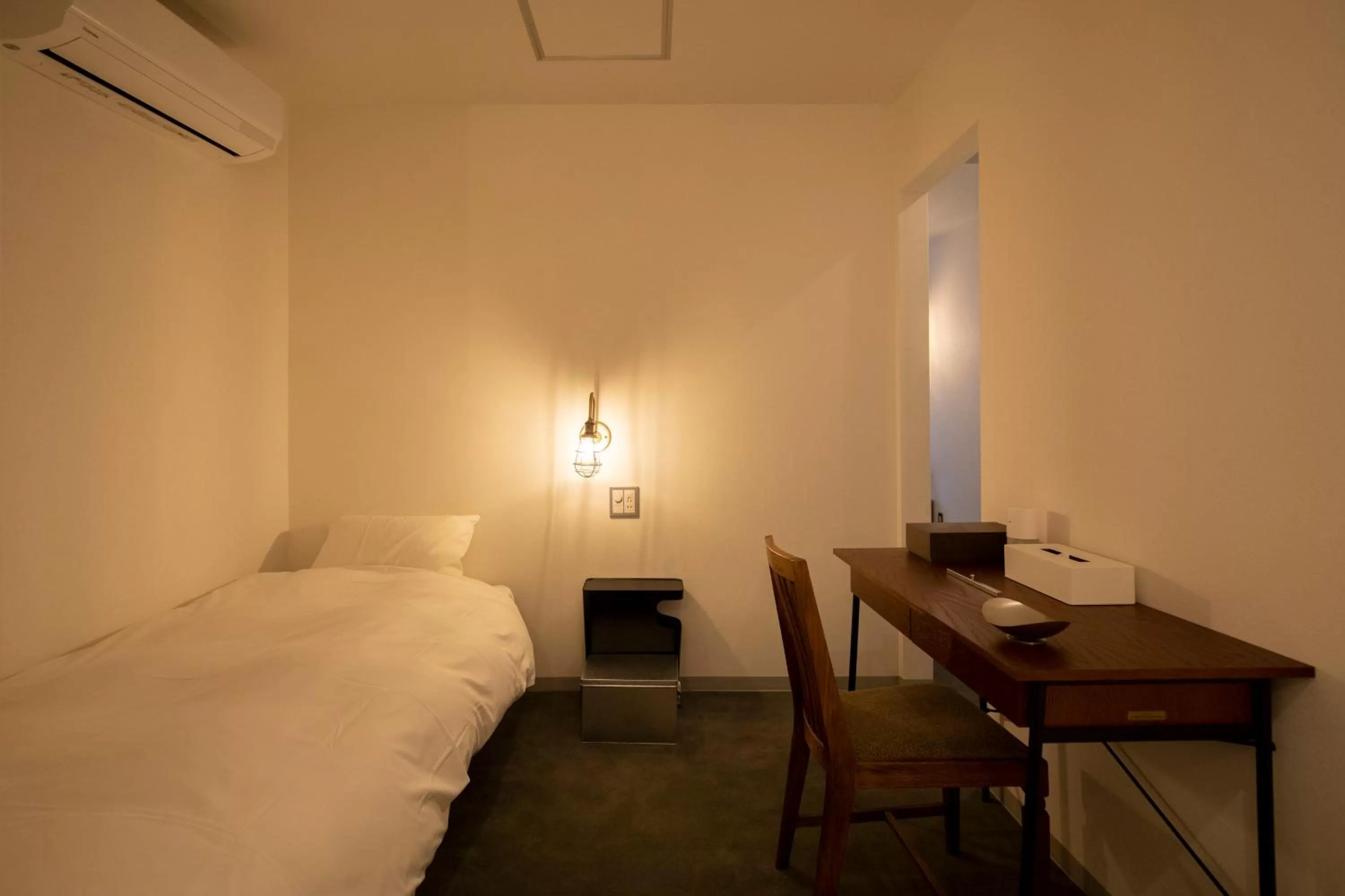 Bed in BENJAMIN HOTEL KANAZAWA