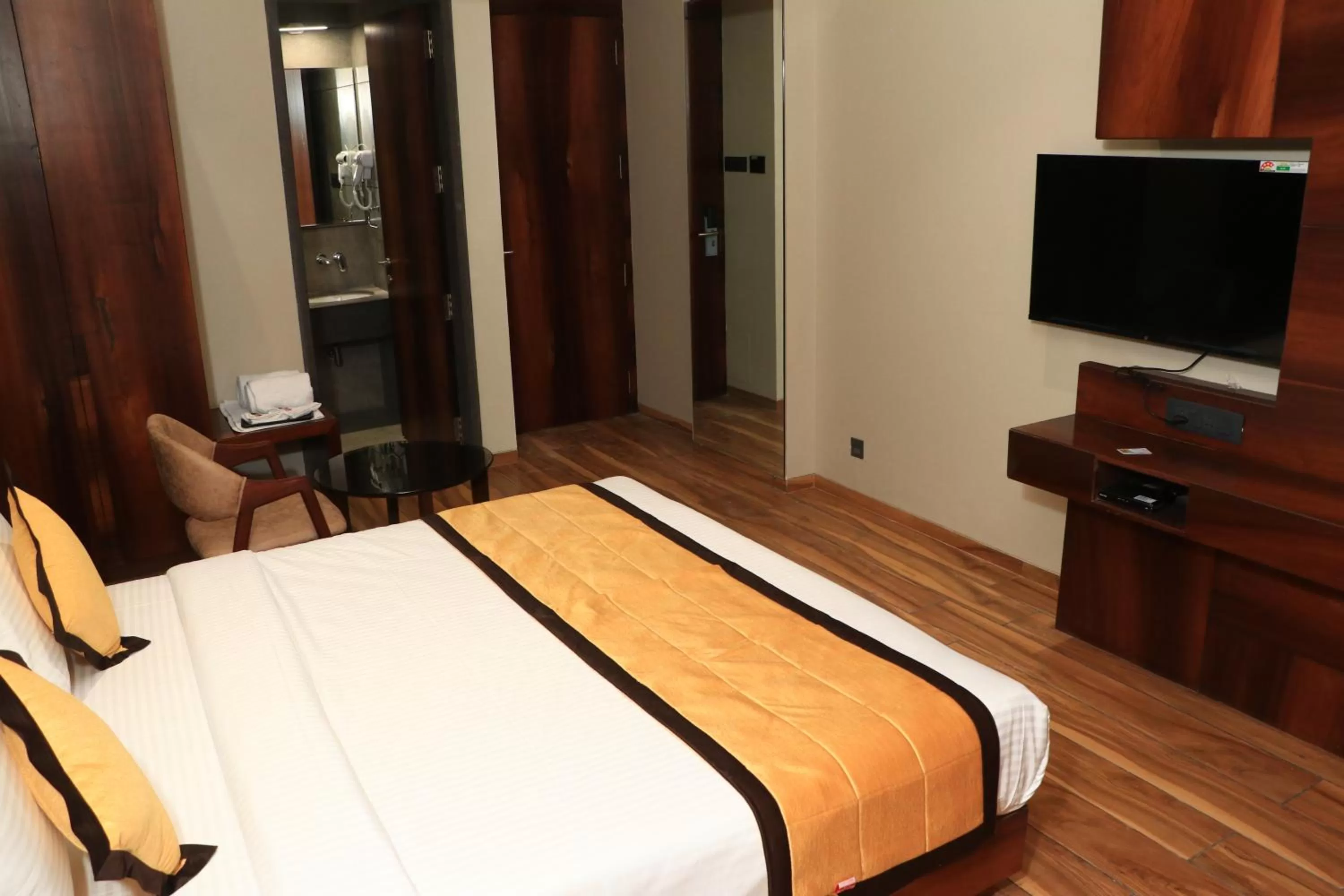 Communal lounge/ TV room, Bed in Hotel Rudra Royals