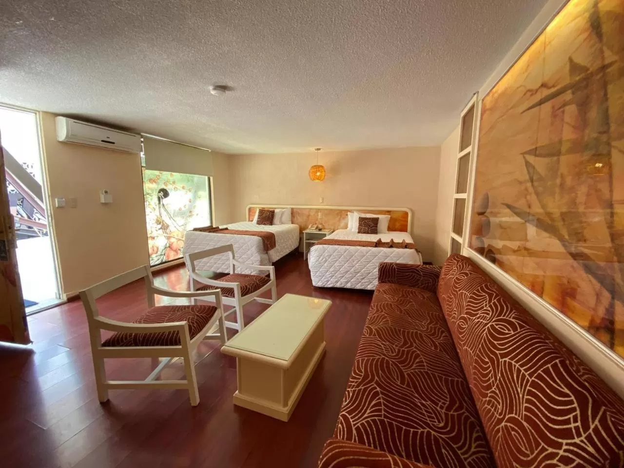 Living room, Bed in Hotel Medrano Temáticas and Business Rooms Aguascalientes