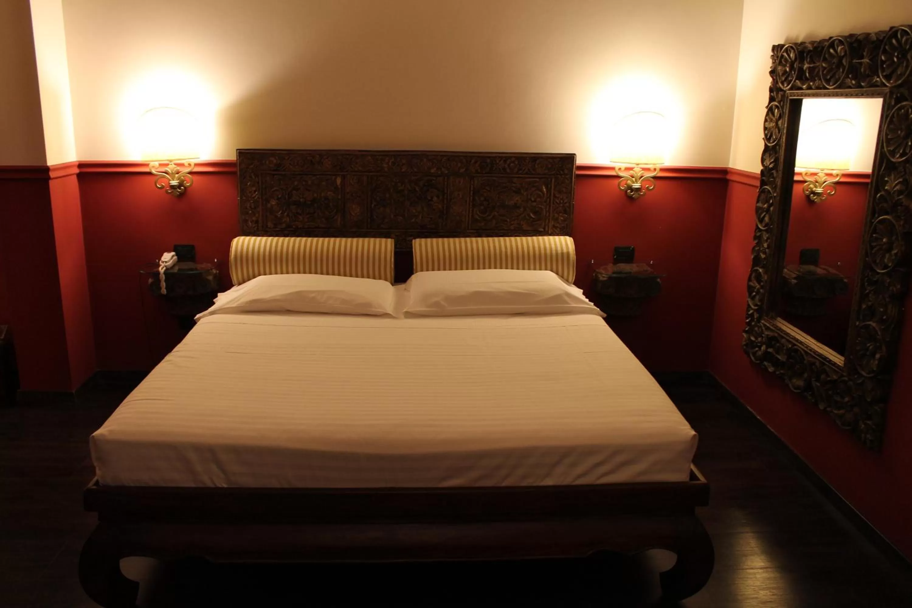 Bed in Hotel Don Carlo