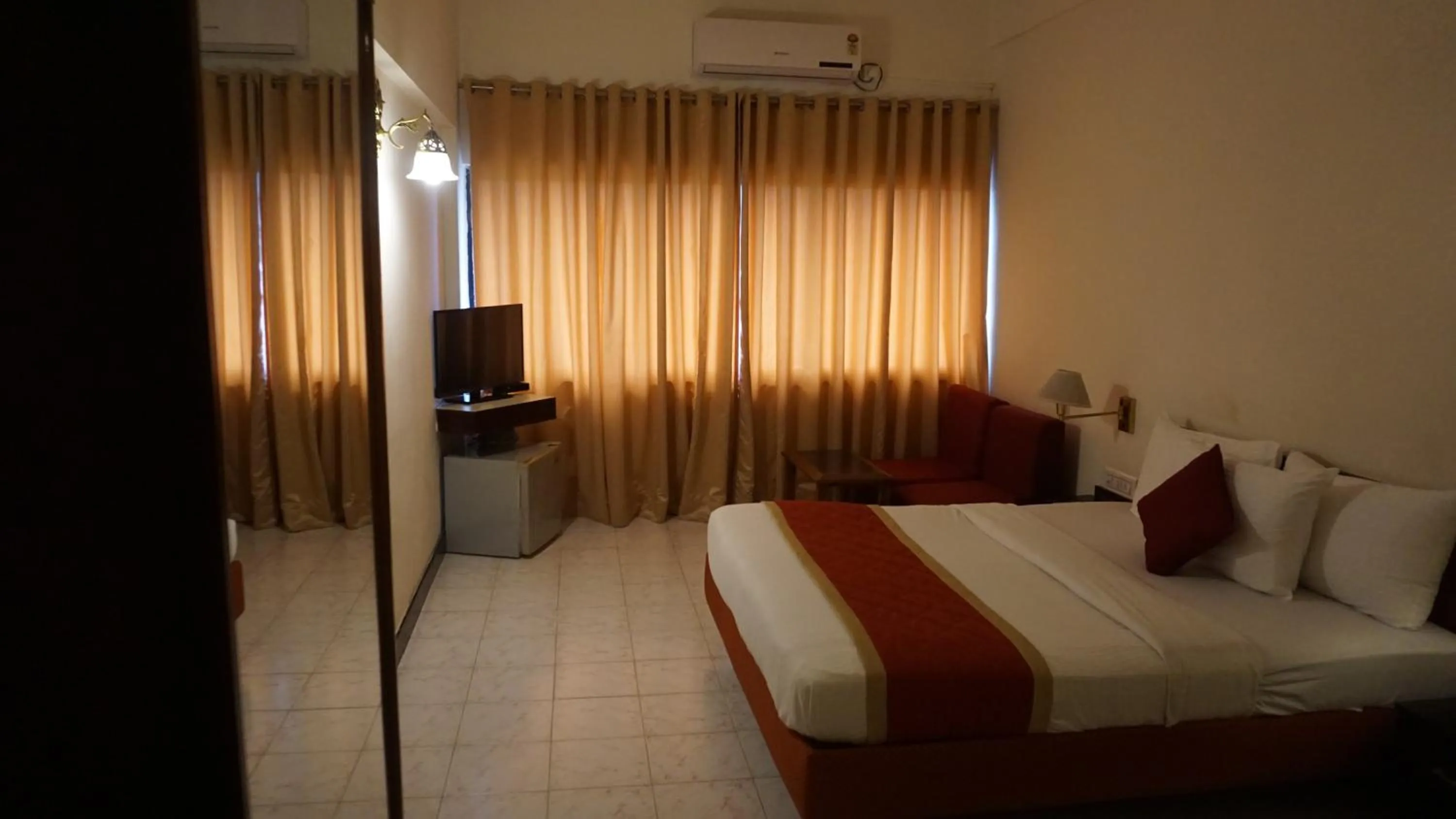 Photo of the whole room, Bed in Hotel Poonja International