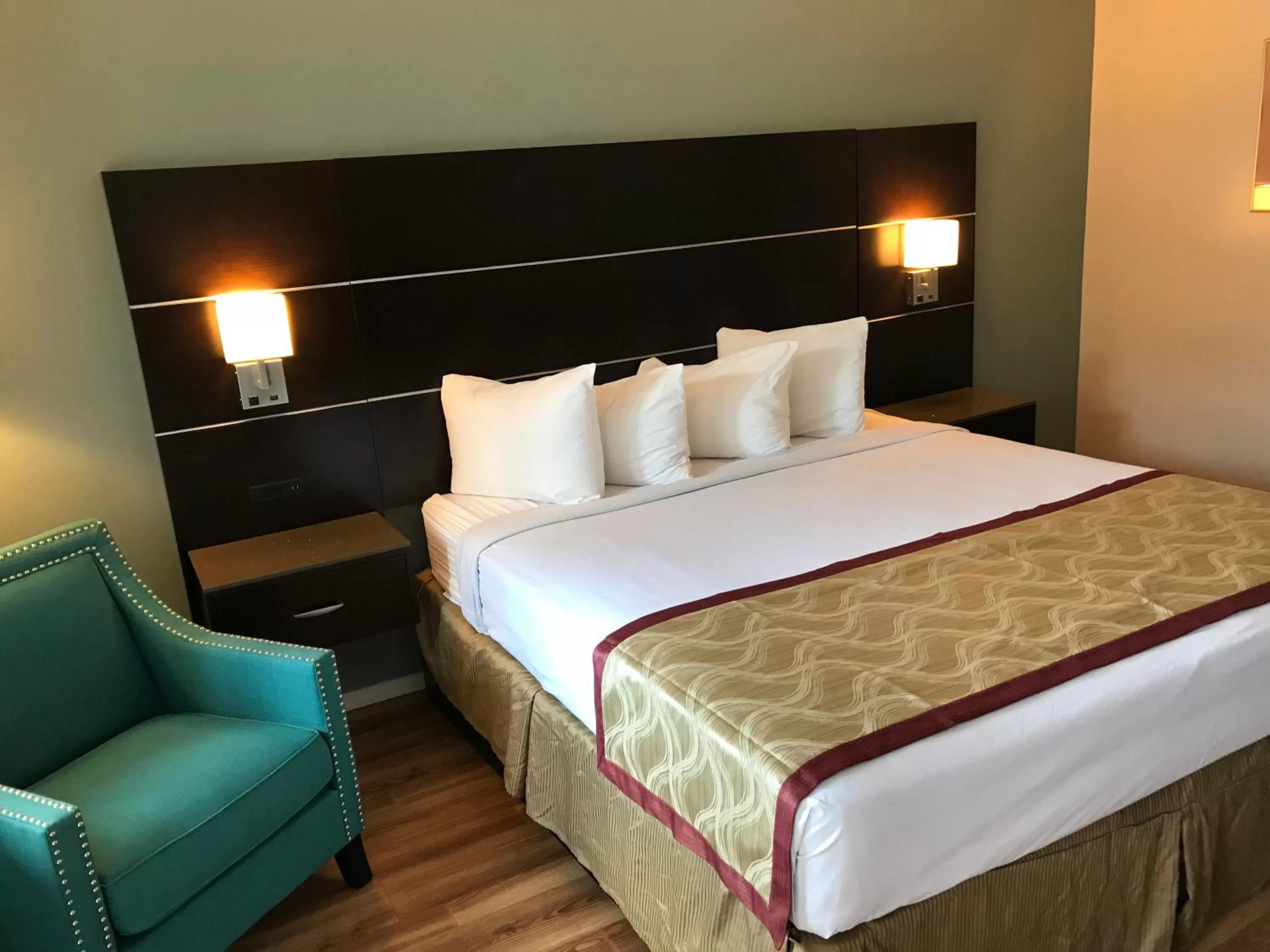 Bed in Olive Tree Inn & Suites