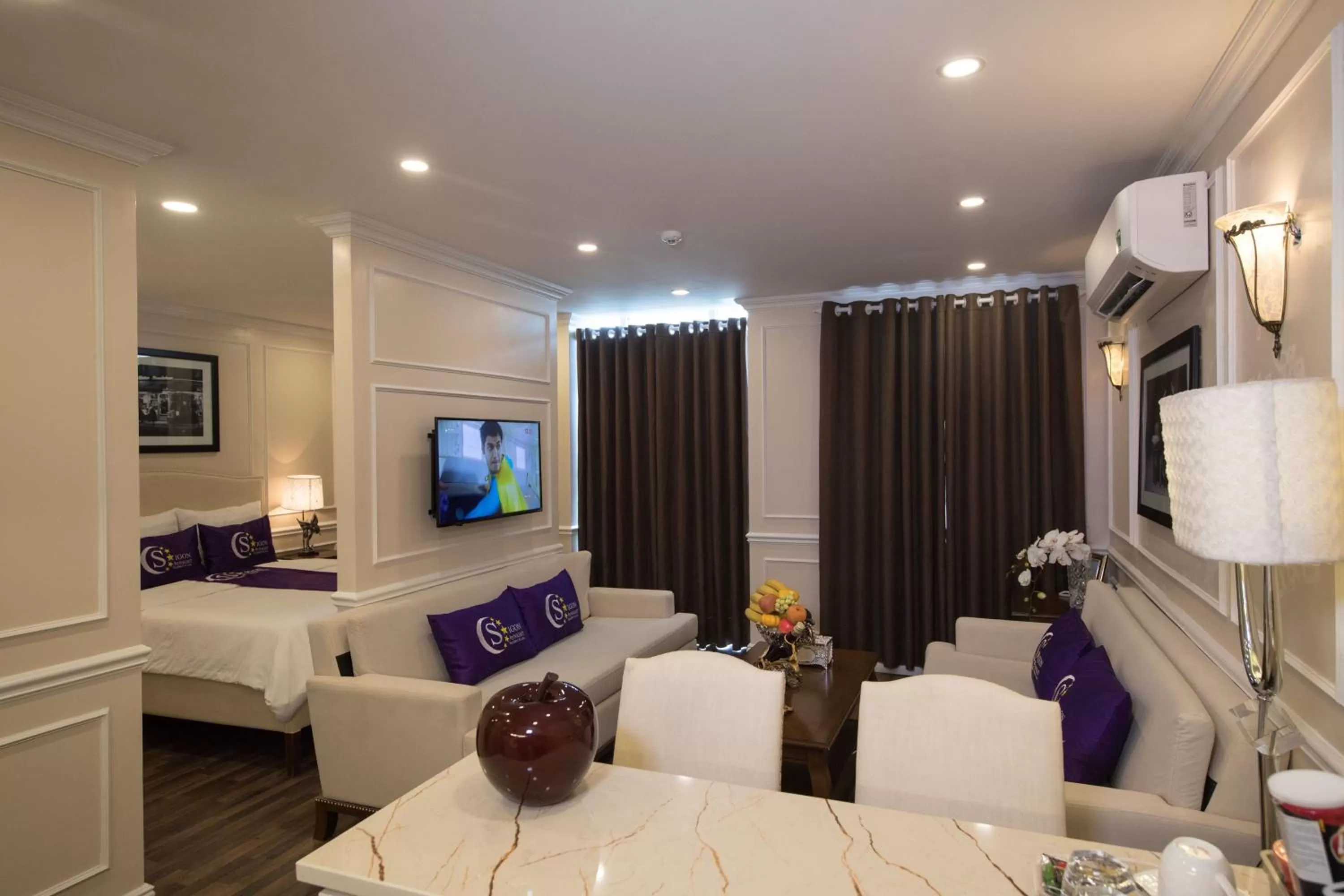 Bed in Saigon By Night Luxury Hotel