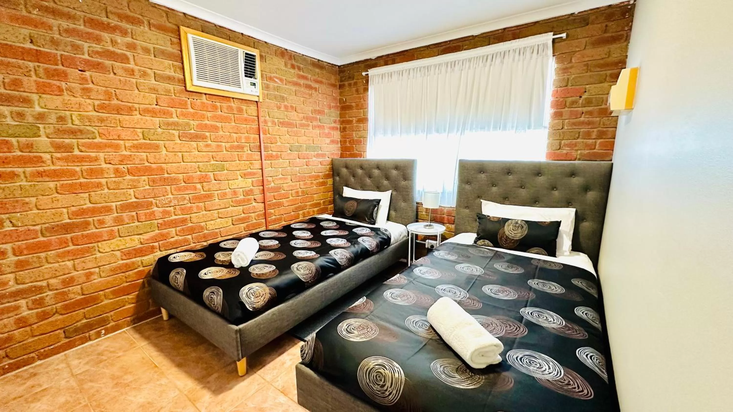 Bed in Early Australian Motor Inn