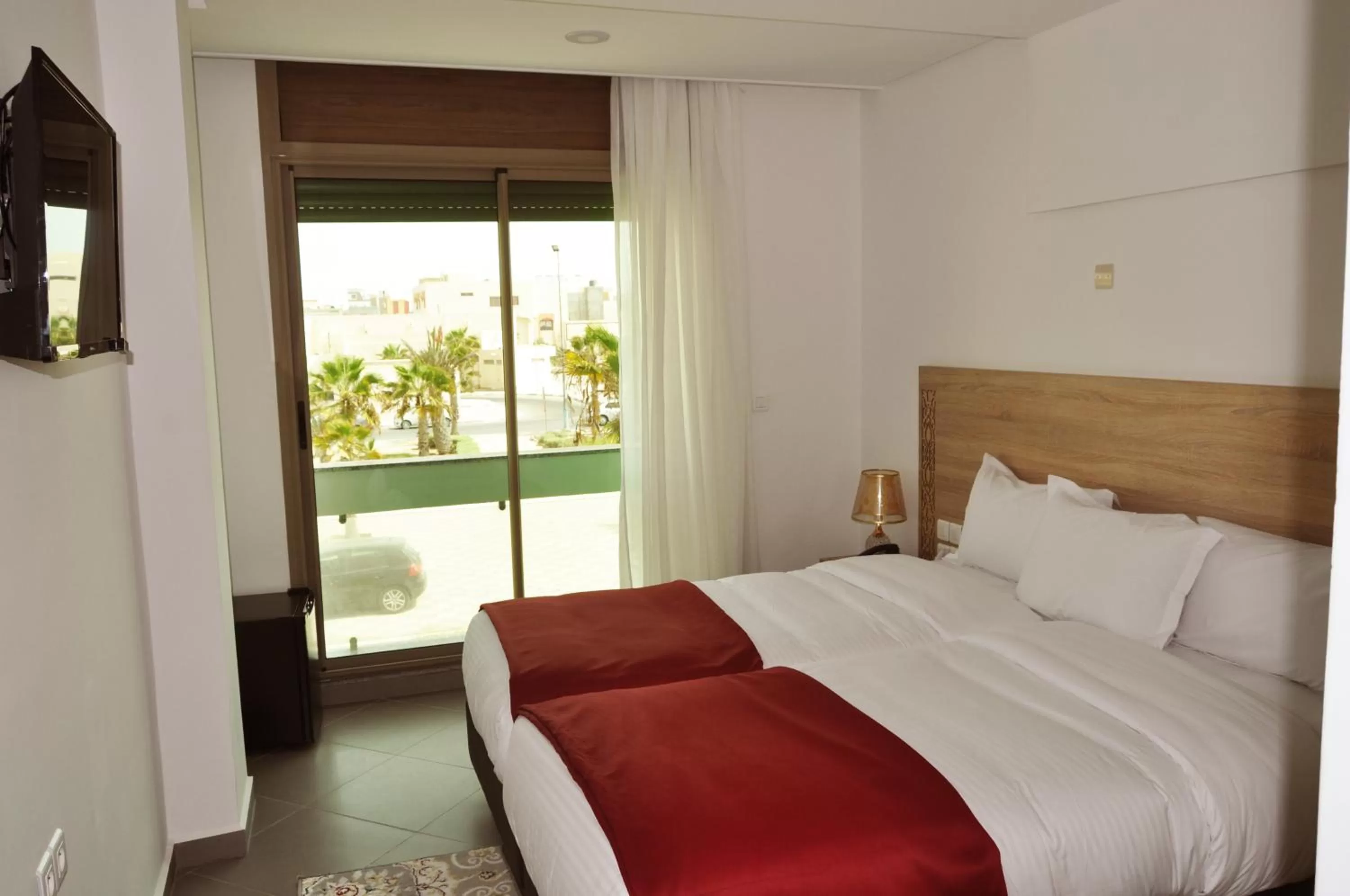 Communal lounge/ TV room, Bed in Dakhla Sur Mer Hôtel