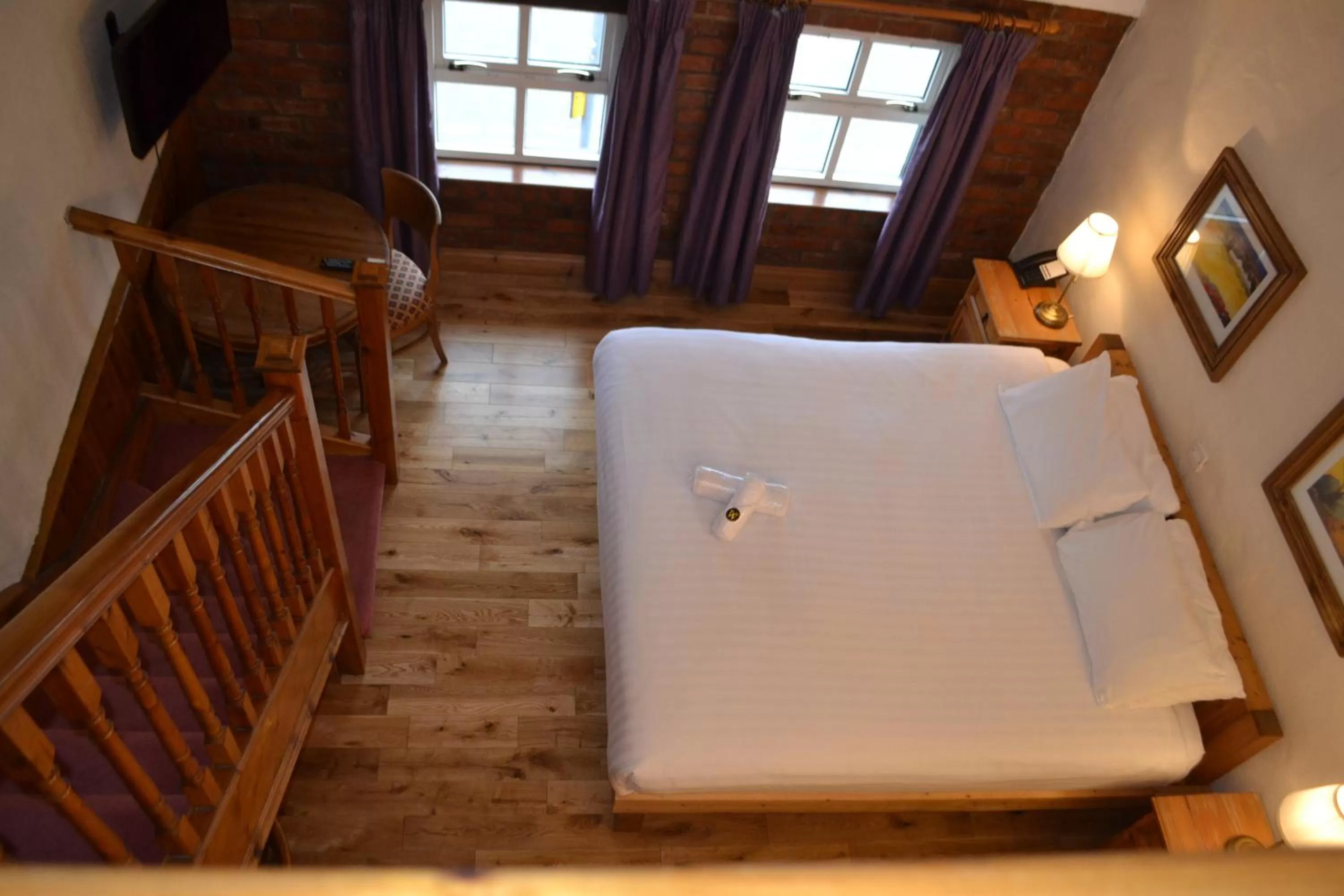 Bed in Walsh's Hotel and Apartments