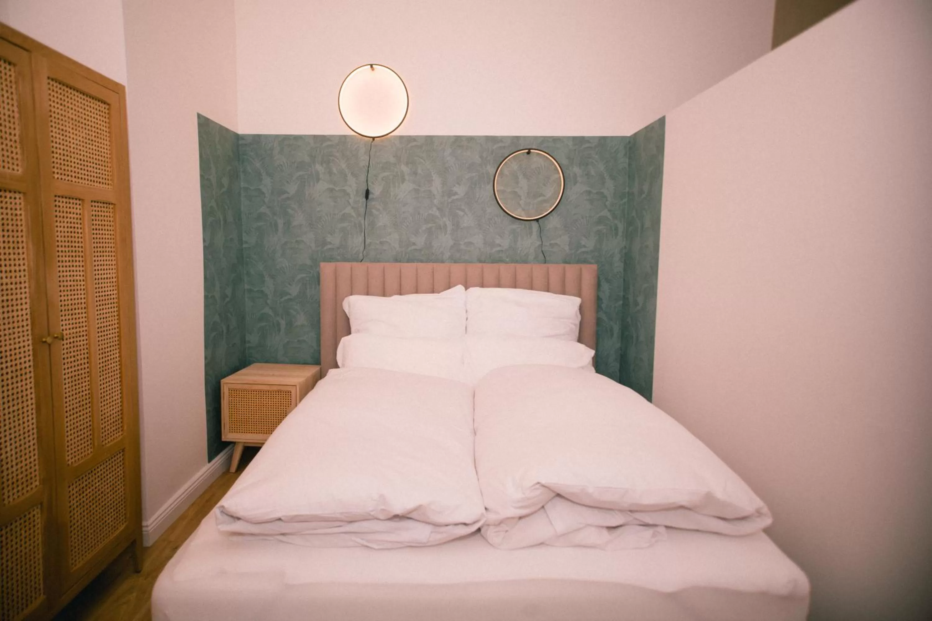 Bed in The Weinert Suites