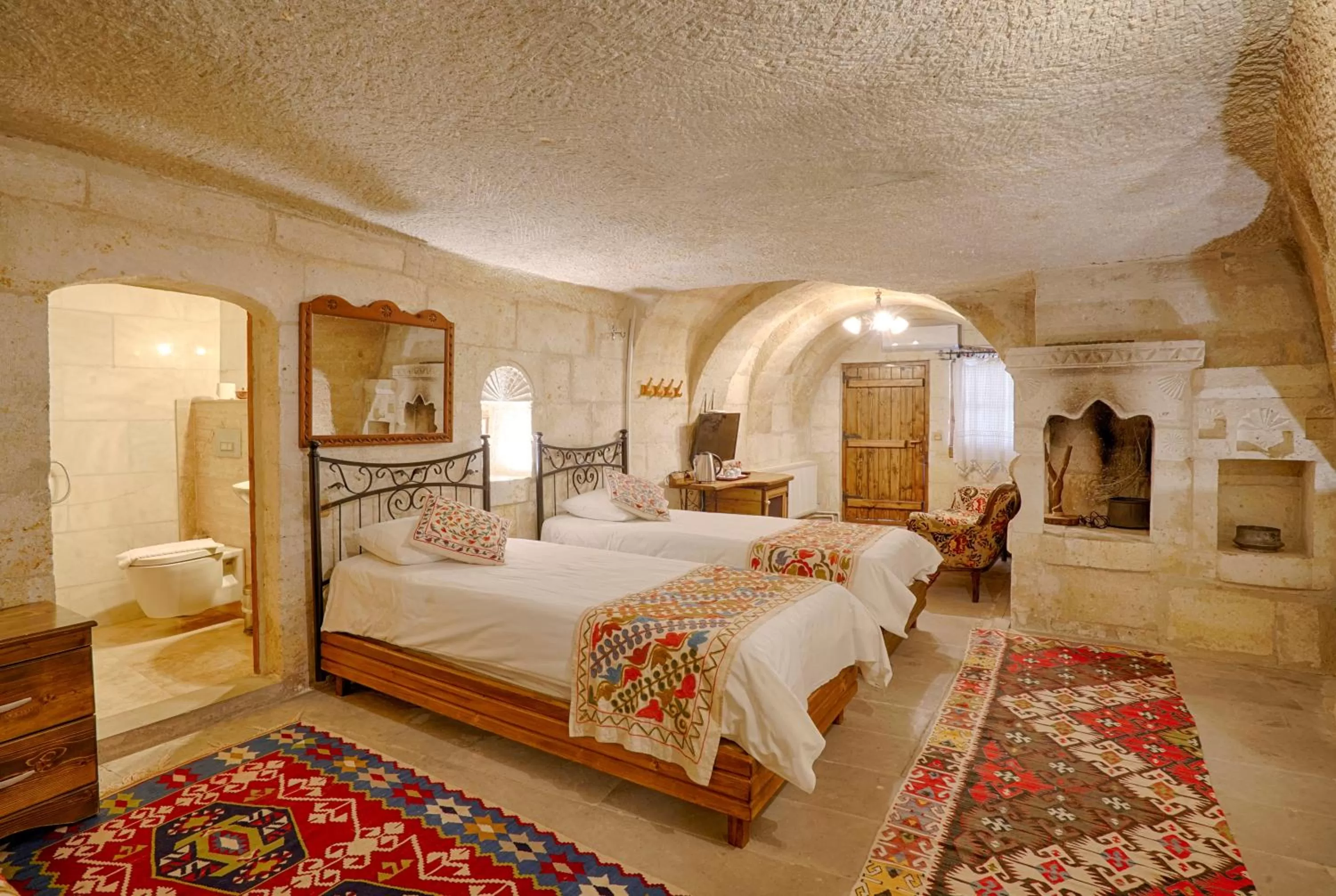 Bed in Tulip Cave Suites