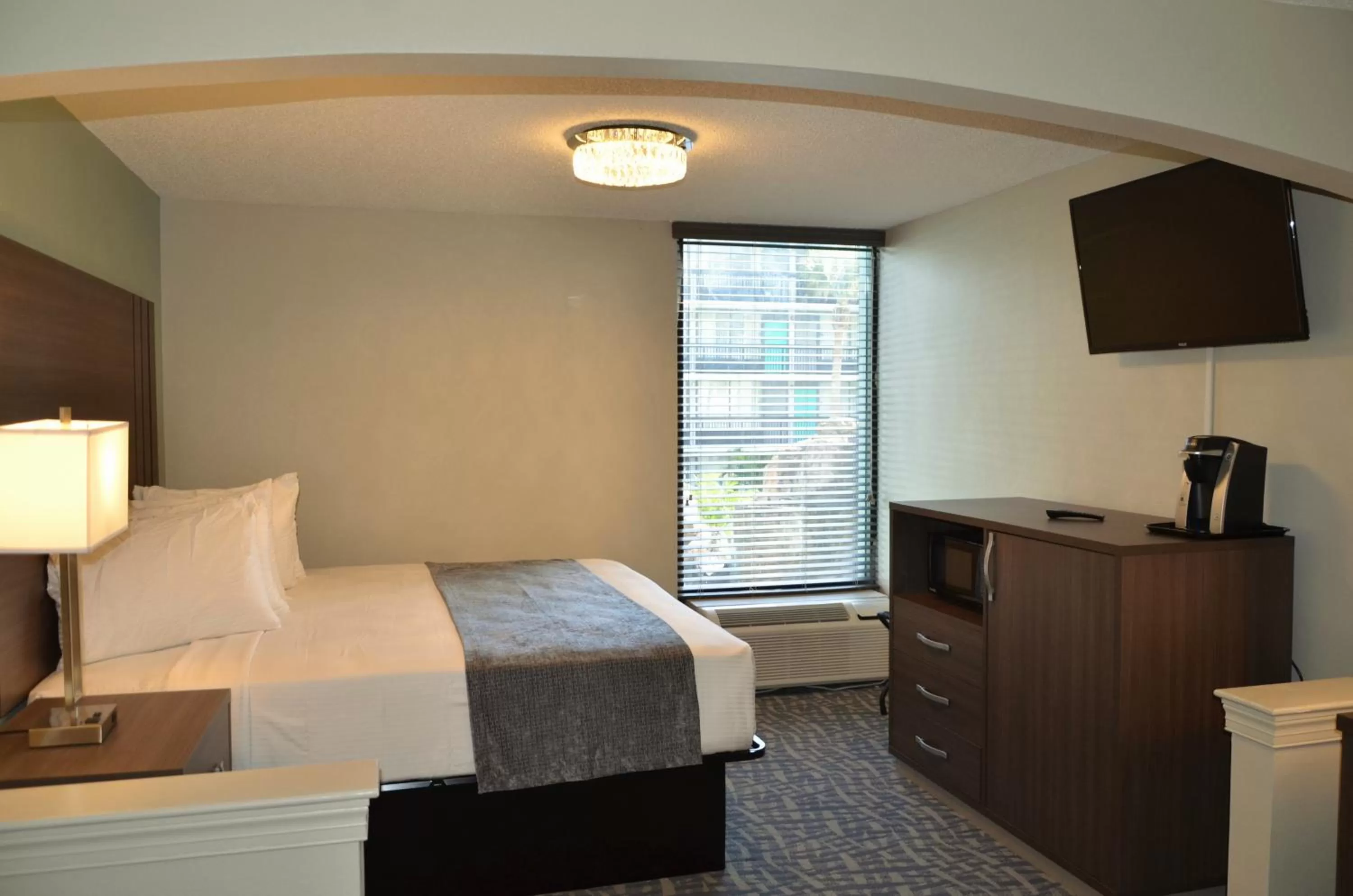 Bed in Opal Hotel & Suites