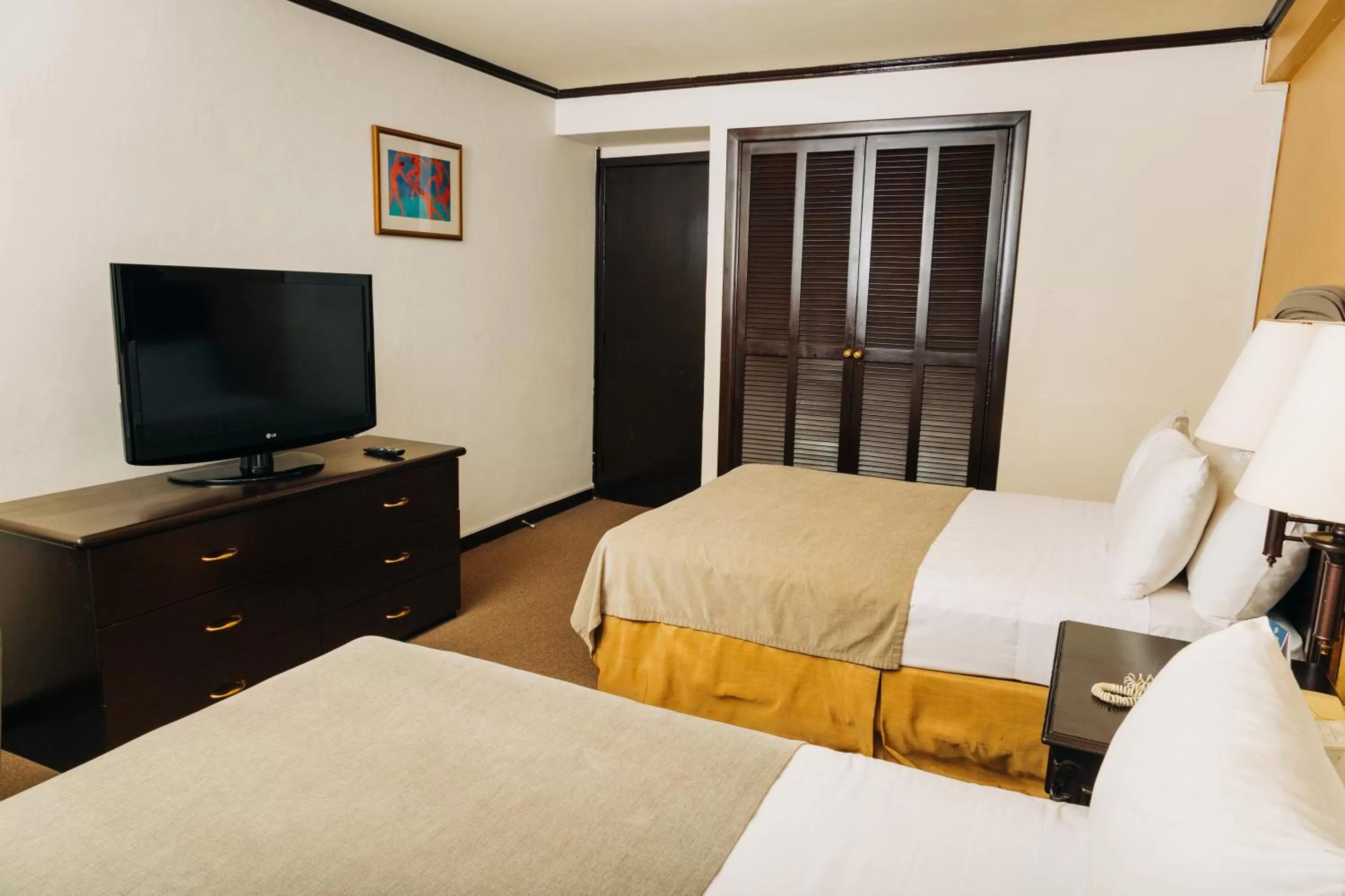 Bed in Plaza Hotel and Suites