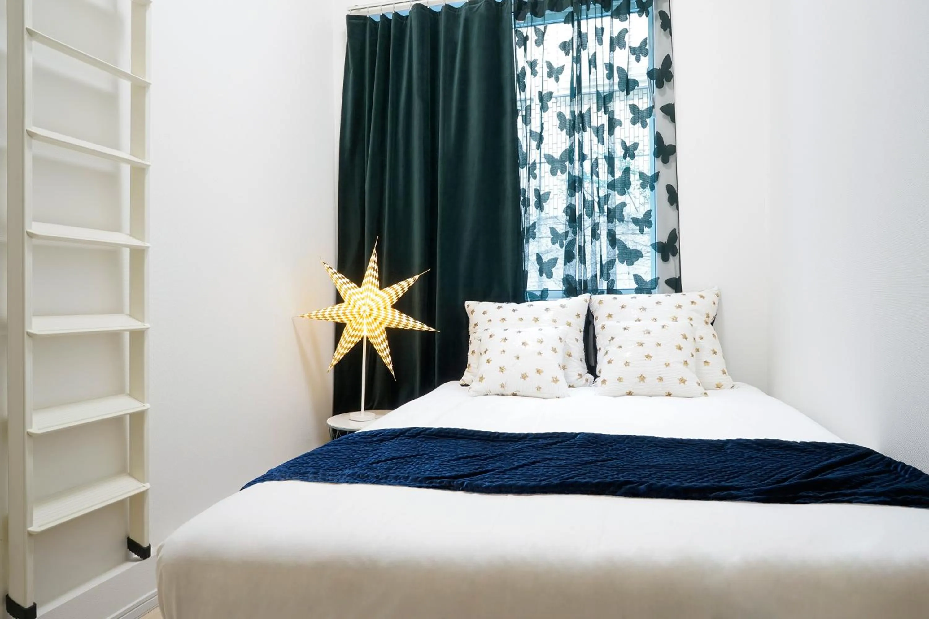 Bed in Blue Empire Hotel