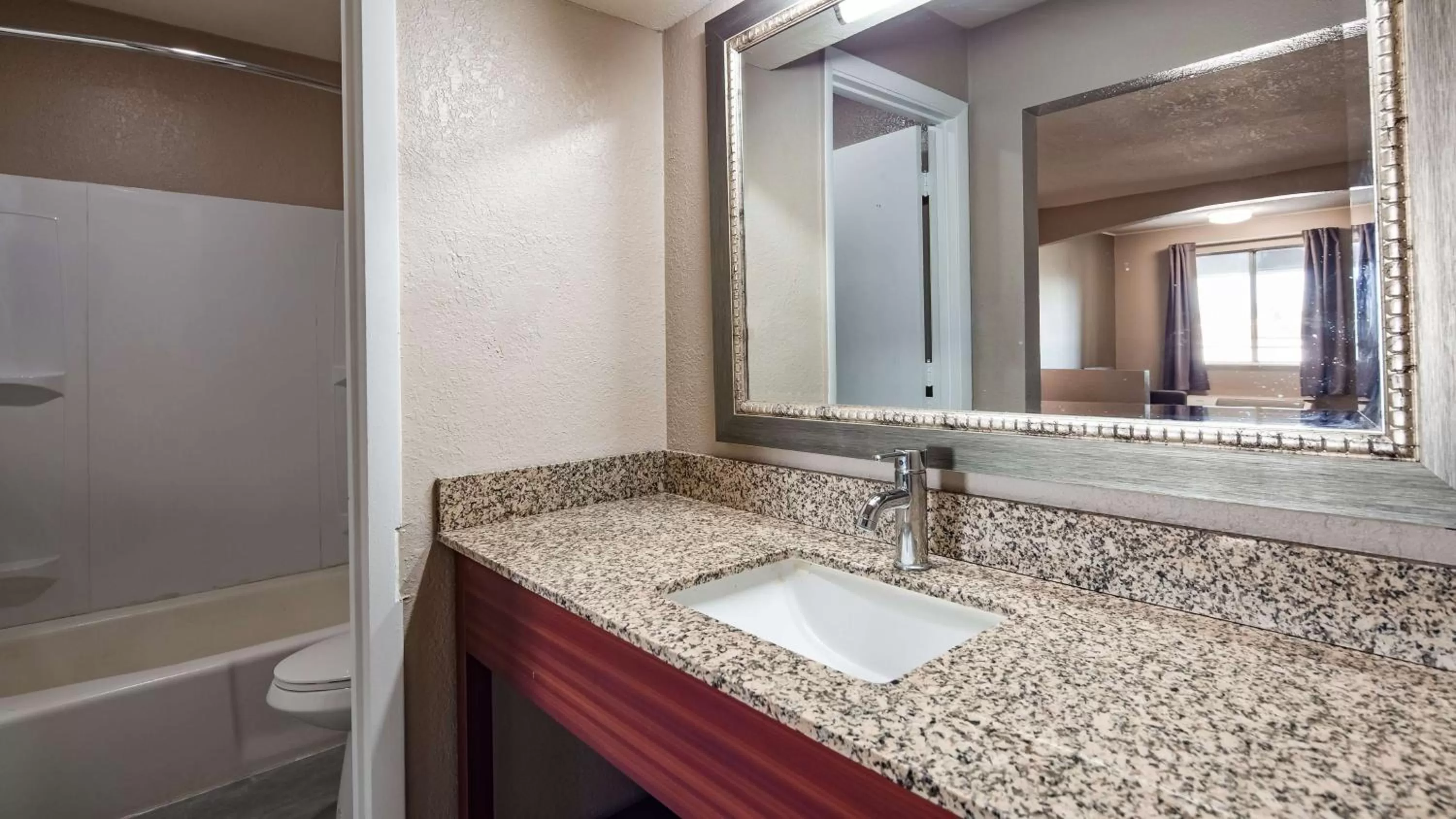Bathroom in SureStay Hotel By Best Western Olathe