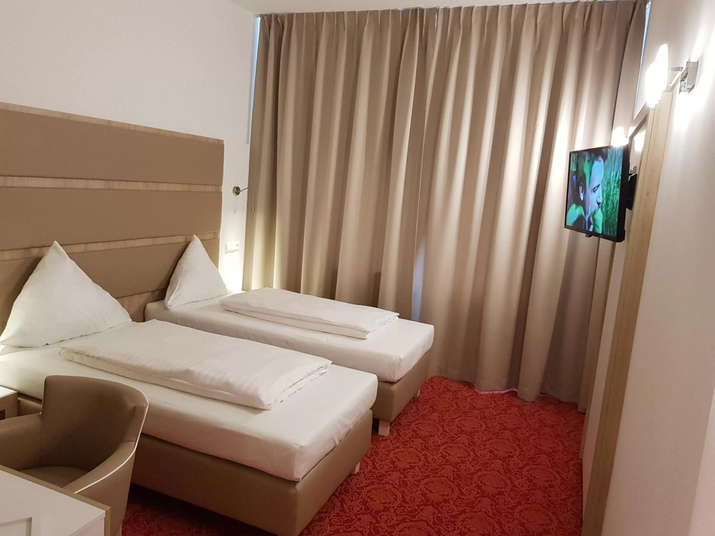 Bed in Confour Hotel