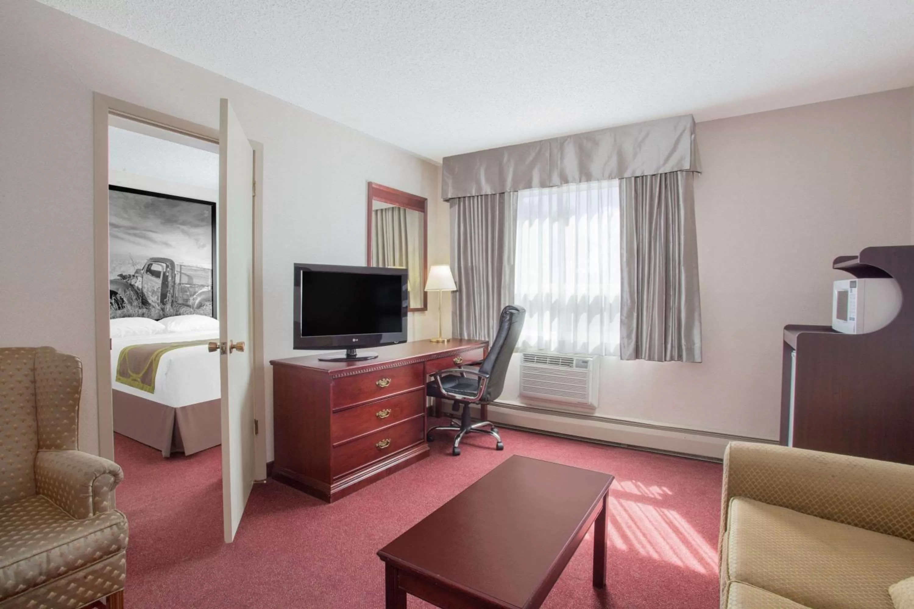 Kitchen or kitchenette in Super 8 by Wyndham Lethbridge