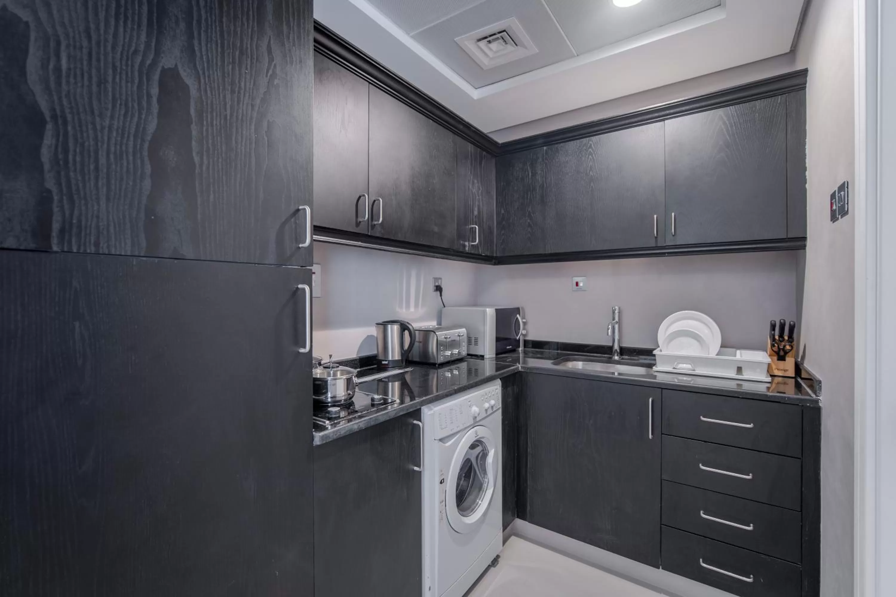 Kitchen or kitchenette in Rose Garden Hotel Apartments - Al Barsha, Near Metro Station