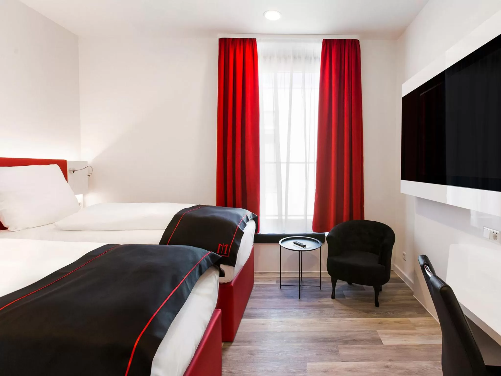 Bed in DORMERO Hotel Roth