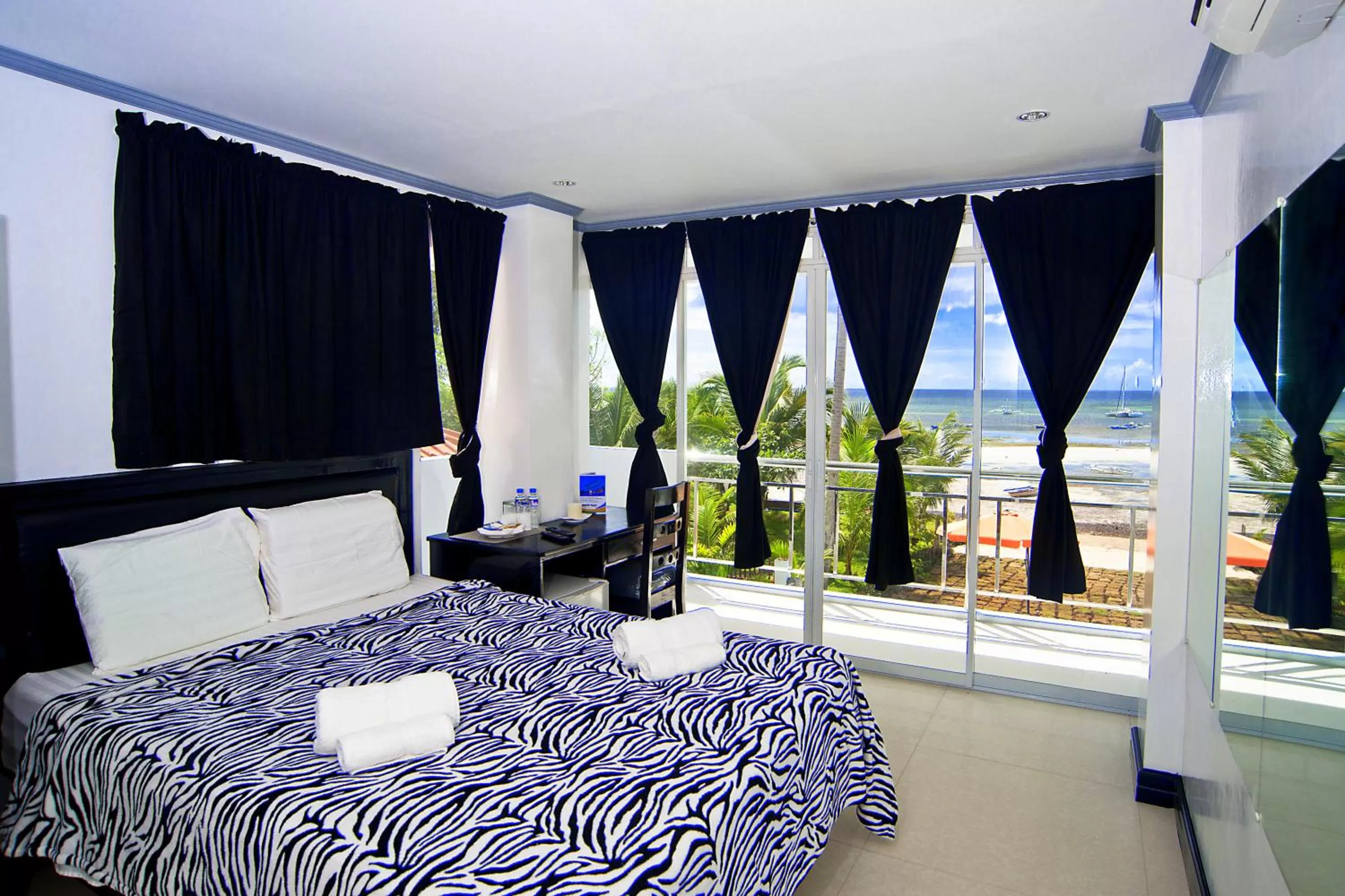 Photo of the whole room, Bed in Bohol South Beach Hotel