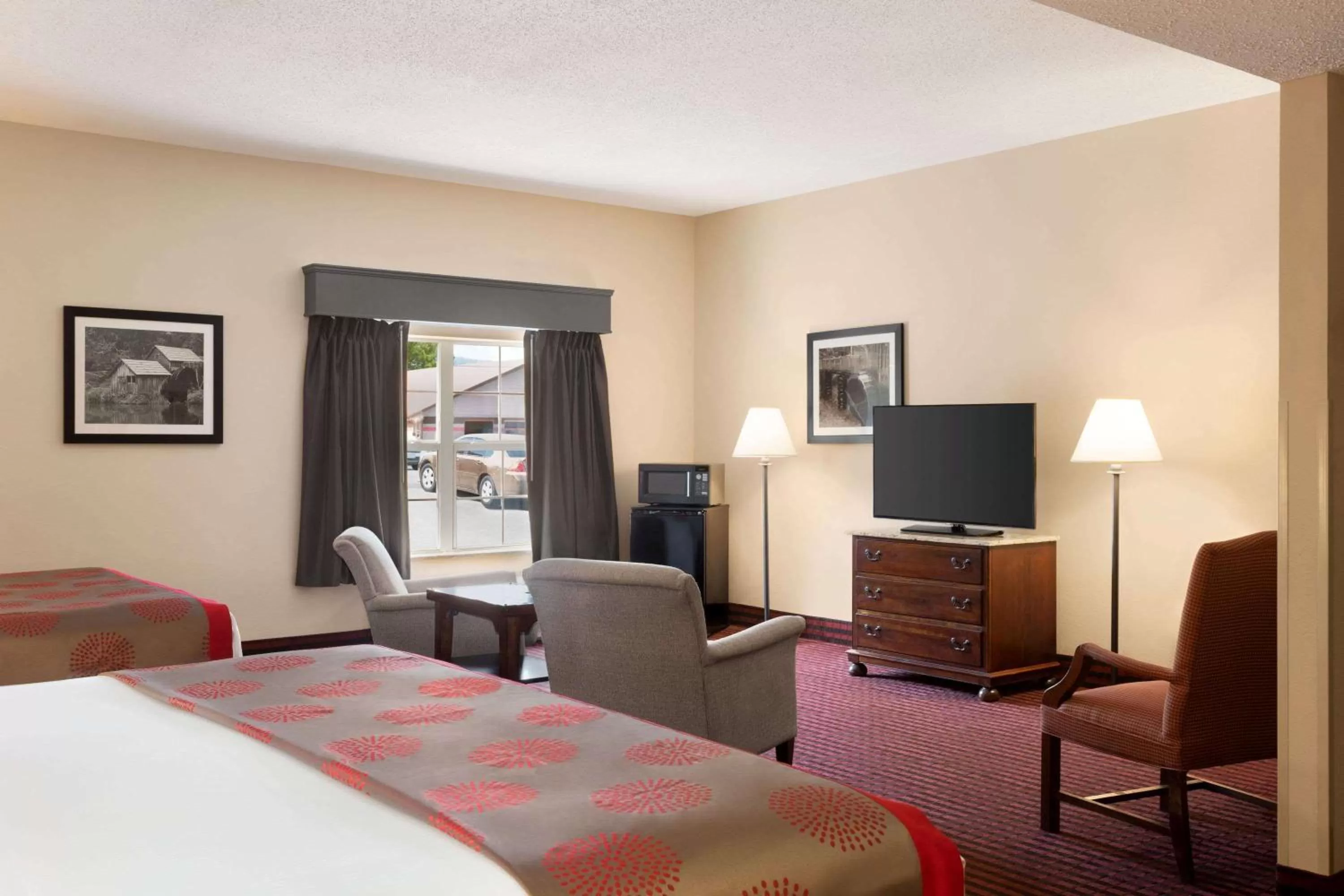 Photo of the whole room, Bed in Ramada by Wyndham Pigeon Forge North