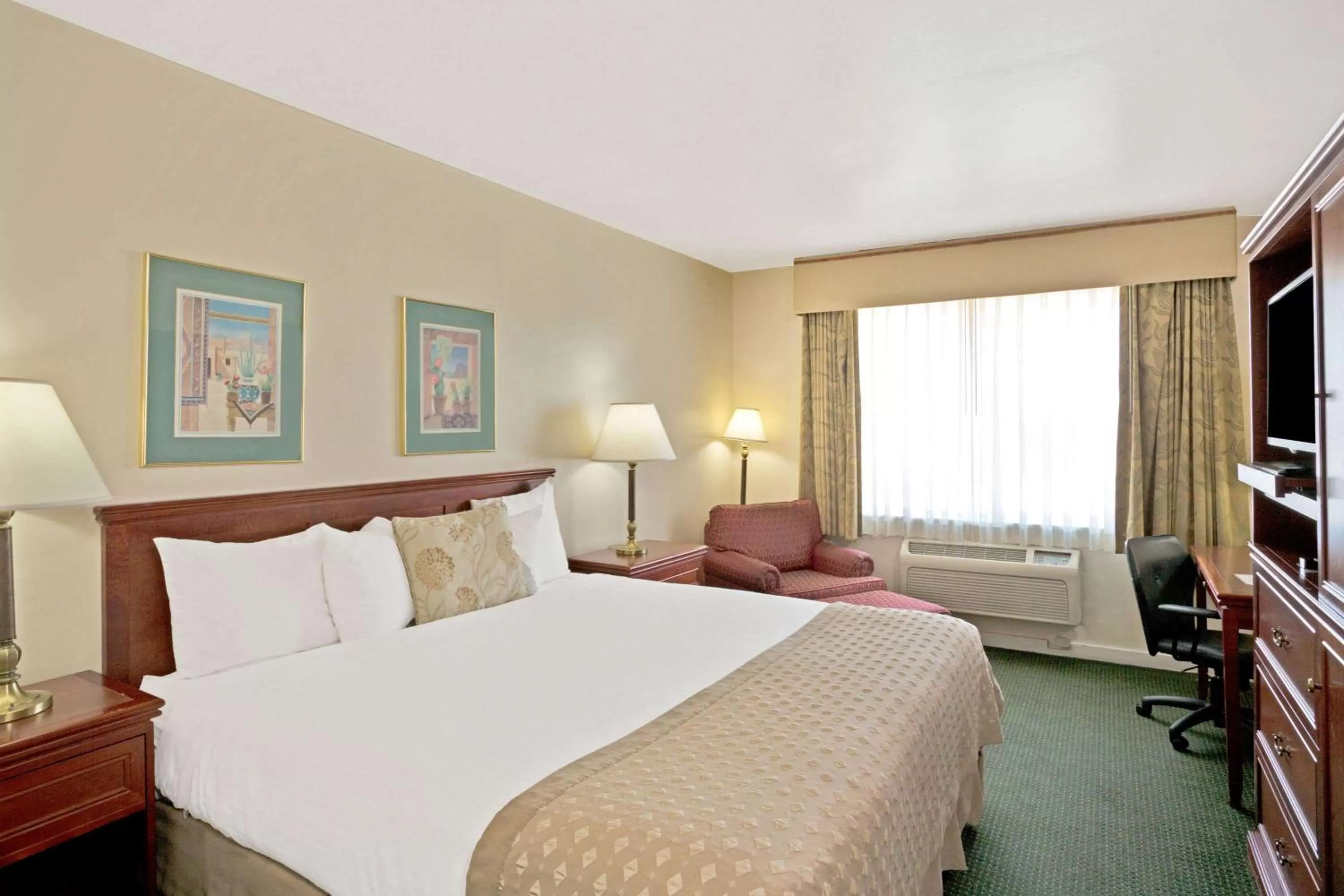 Photo of the whole room, Bed in Ramada by Wyndham Draper, Utah