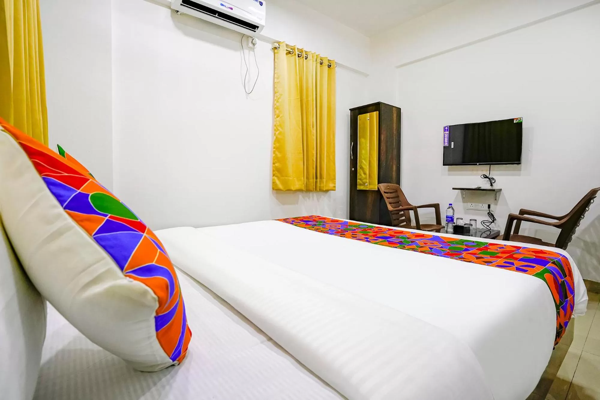 Bed in FabHotel Woods Regency