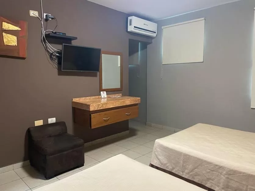 Bed in Hotel Santo Domingo Express