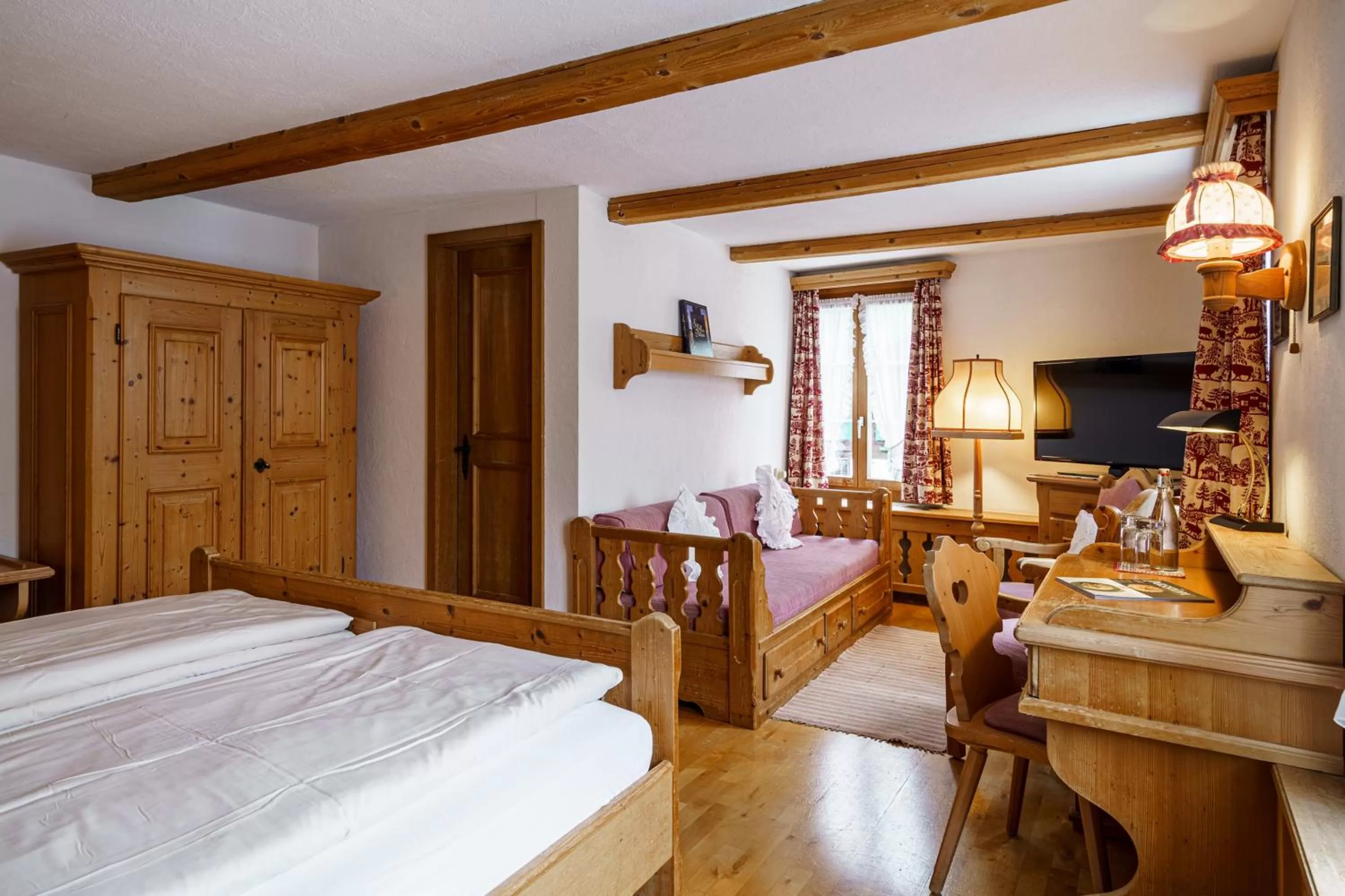 Photo of the whole room, Bed in Alpenblick Hotel & Restaurant Wilderswil by Interlaken