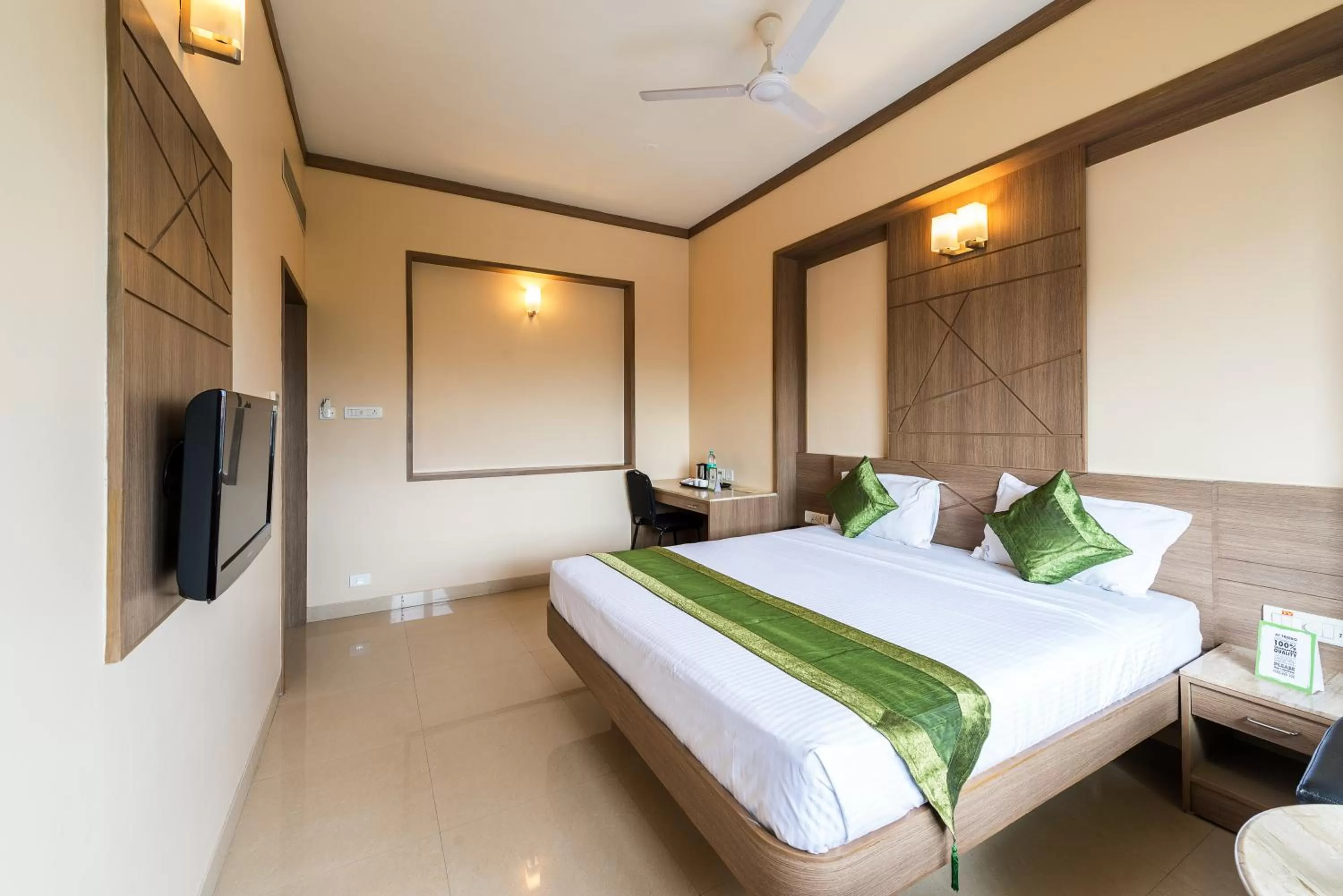 Bed in Treebo ESS Grande