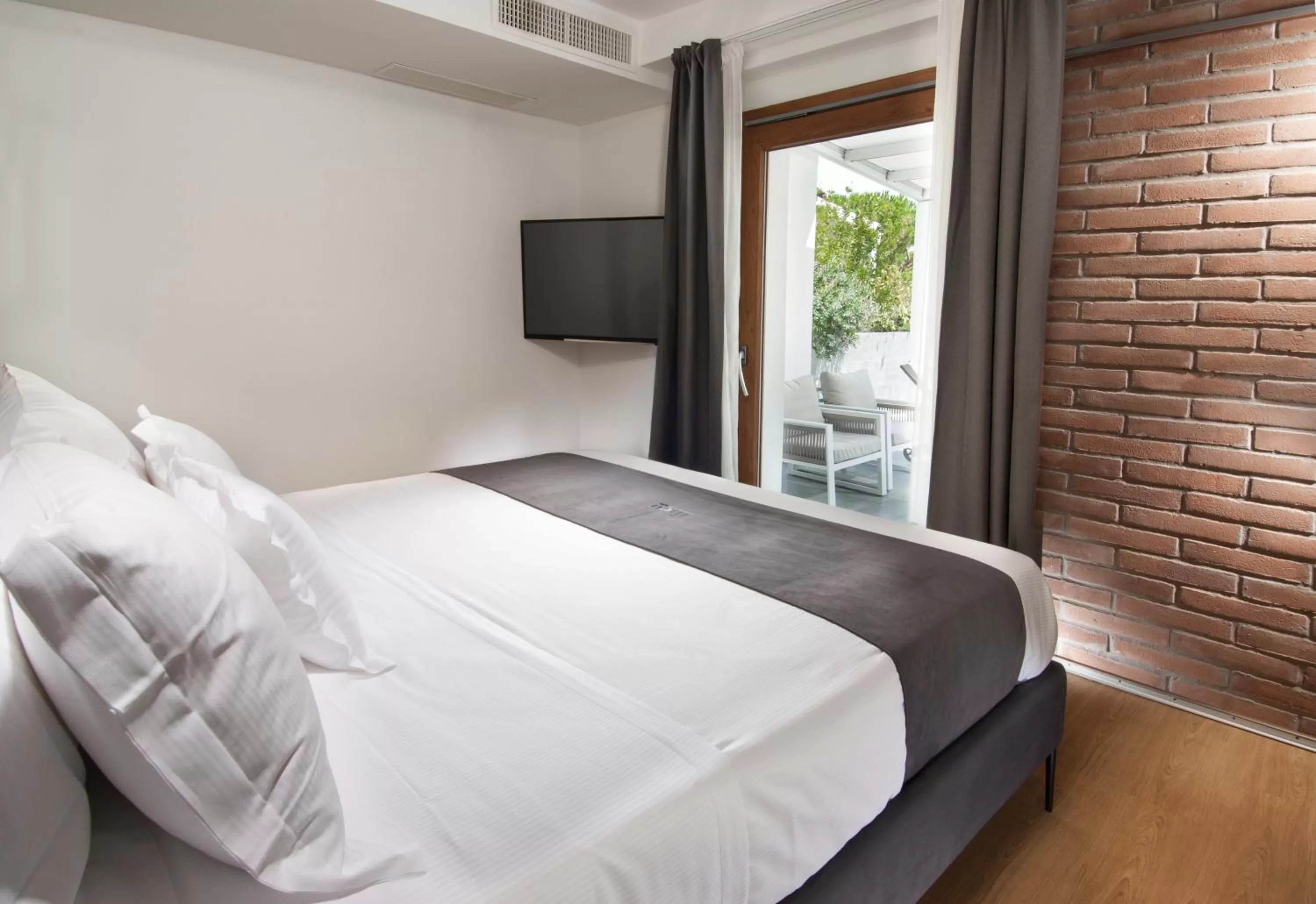 Bed in Meg Lifestyle Hotel & Apartaments