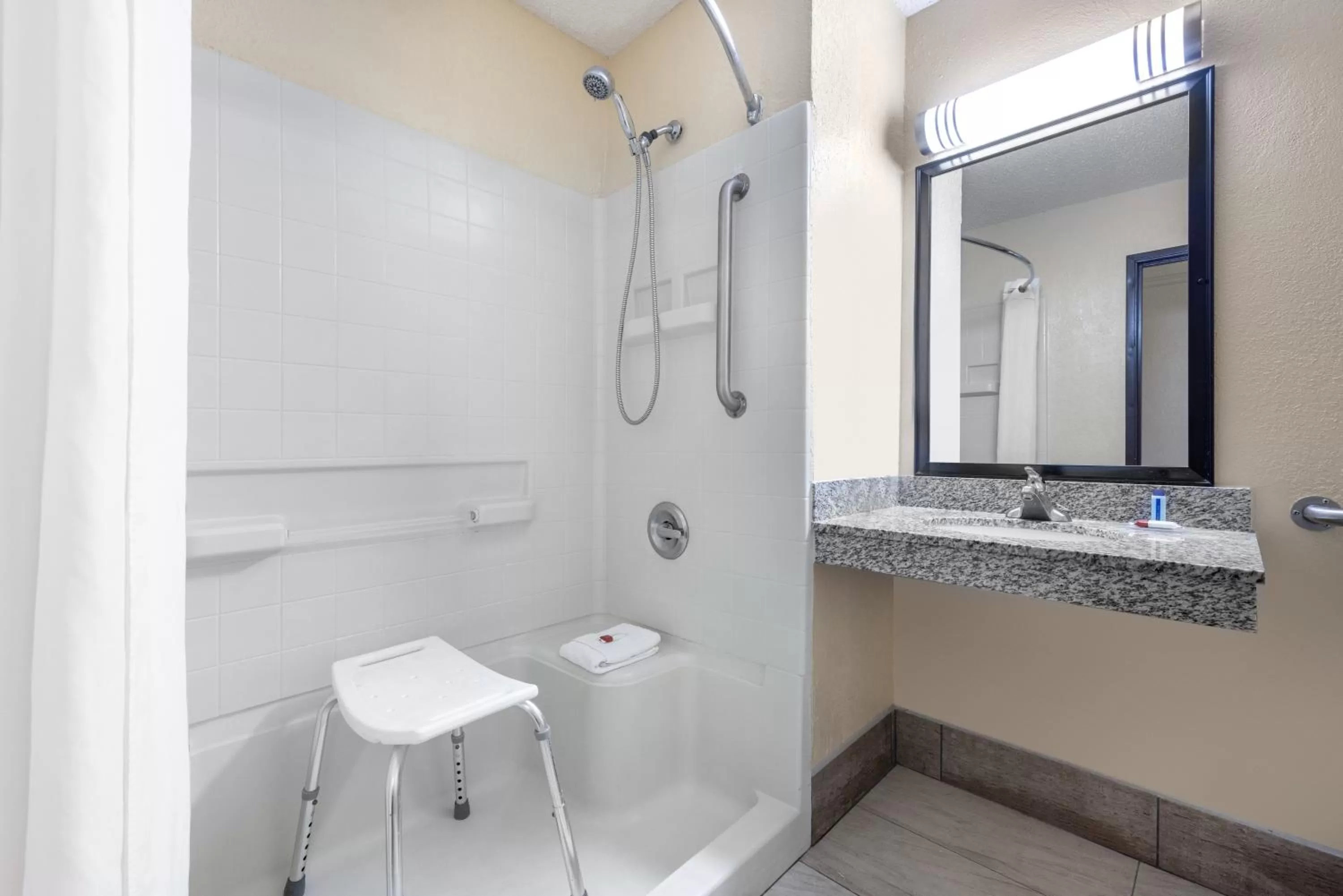 Bathroom in Super 8 by Wyndham Kansas City at Barry Road/Airport