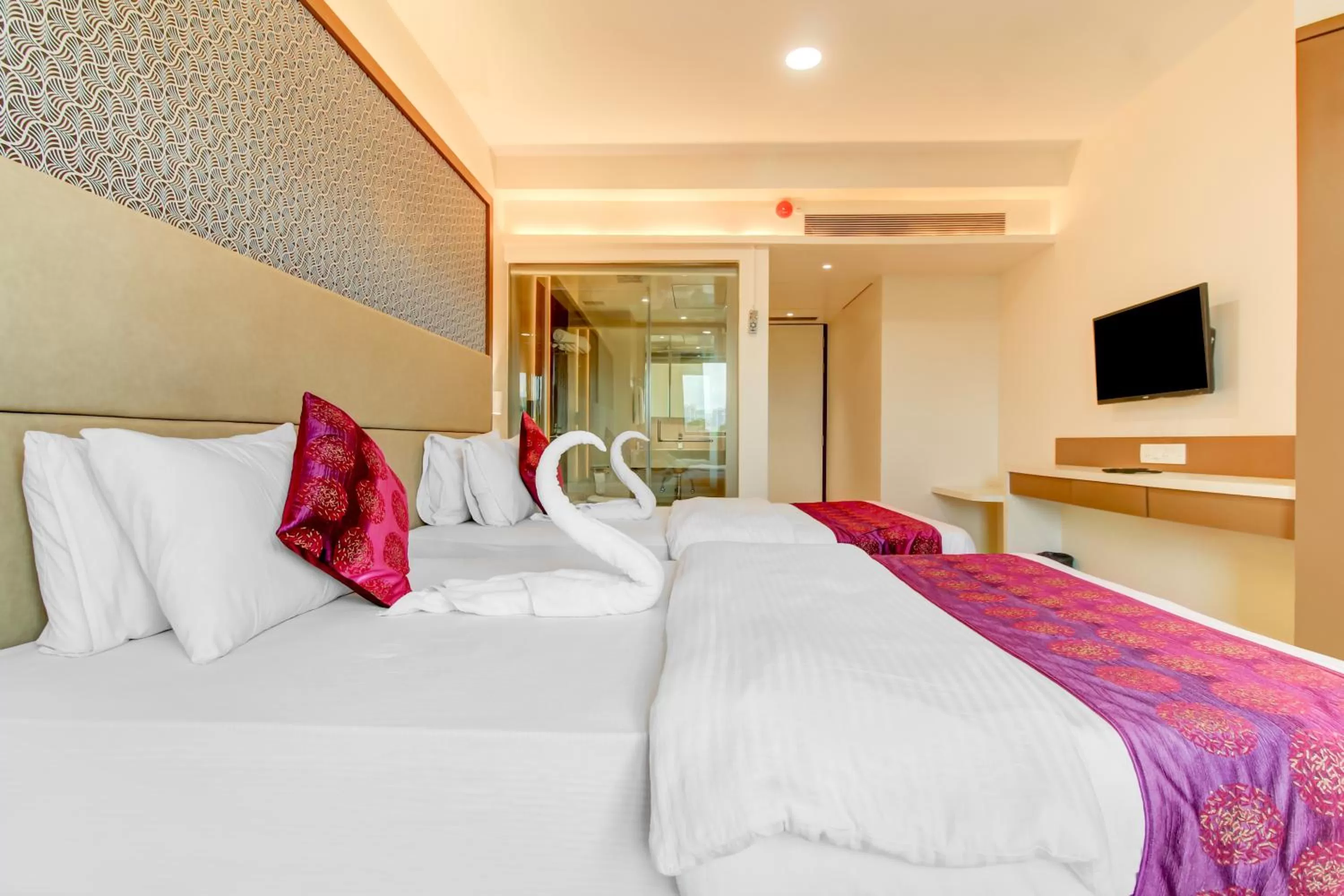 Photo of the whole room, Bed in Grand Mookambika