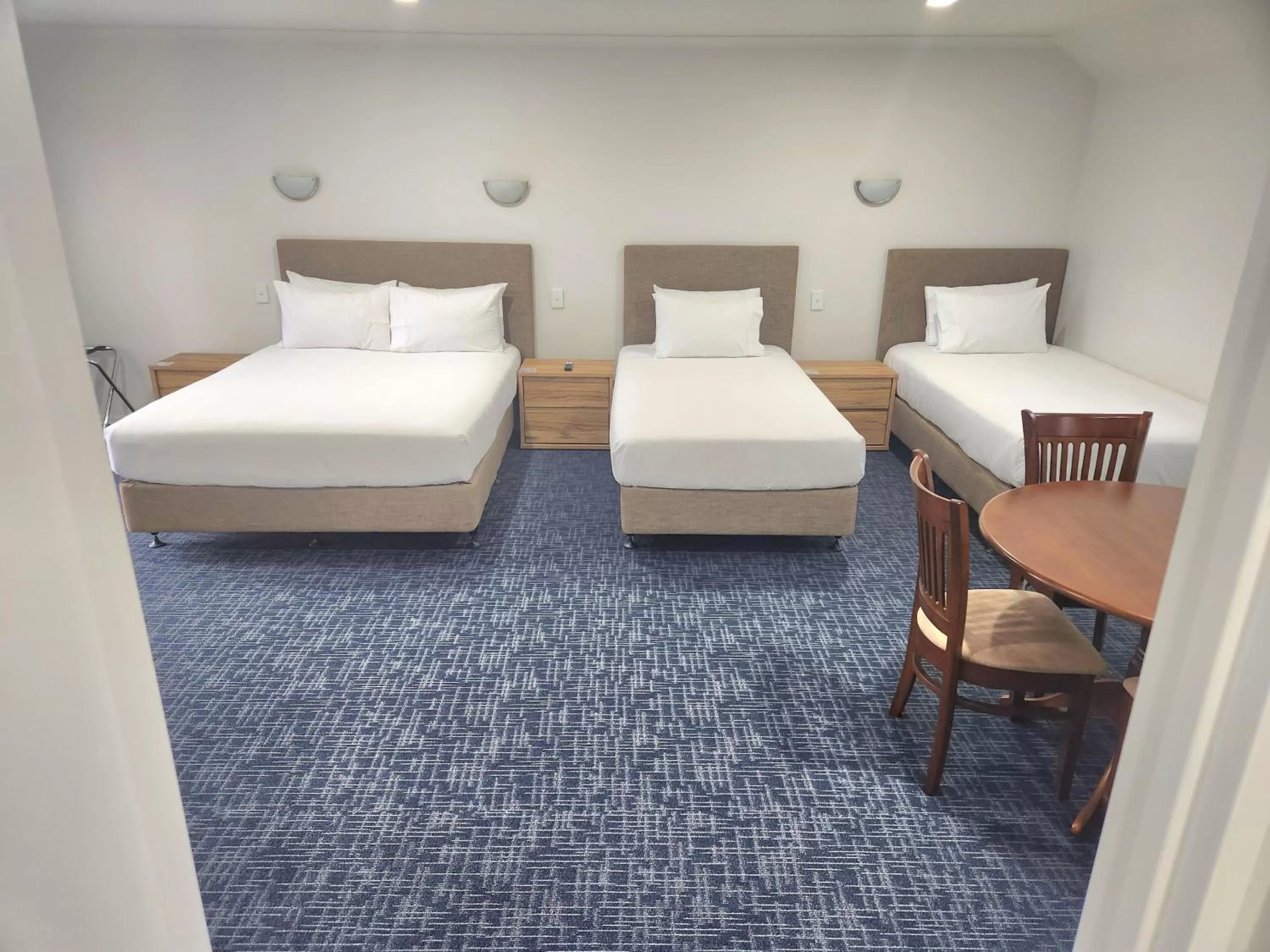 Bed in Botany Palms Motel