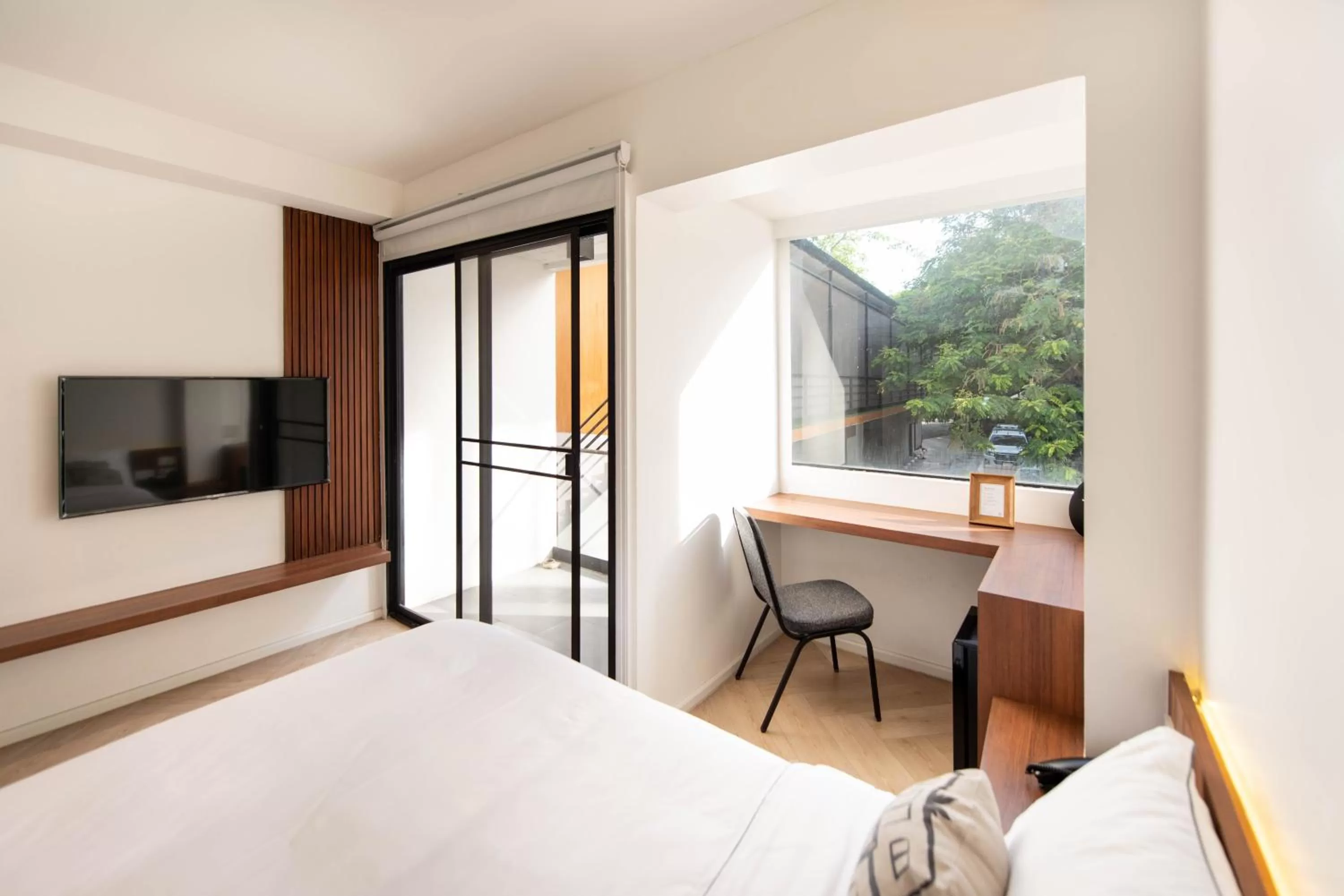 Bed in Botanic Service Room at Impact Muangthongthani - SHA Certified