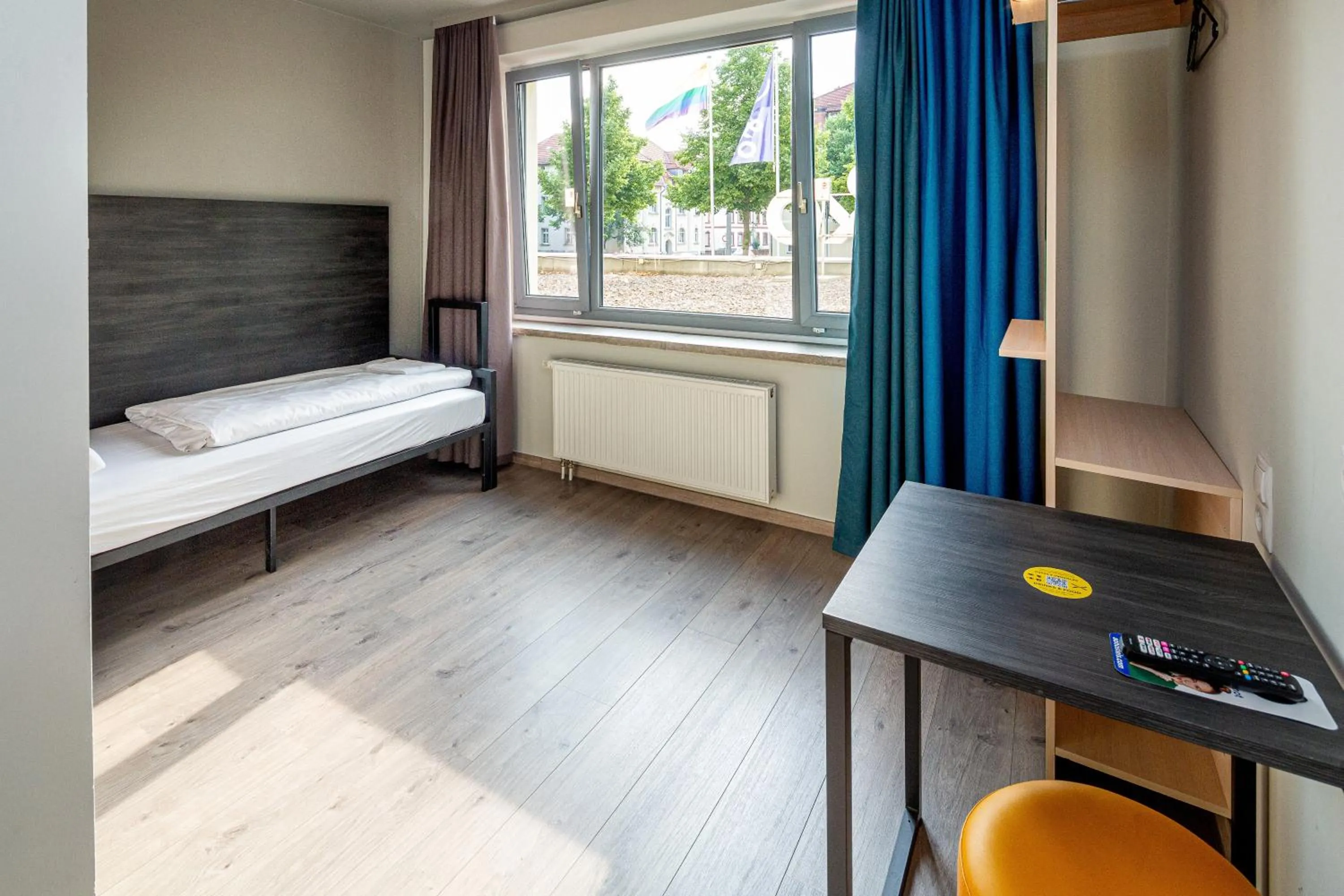 Seating area, Bed in a&o Weimar