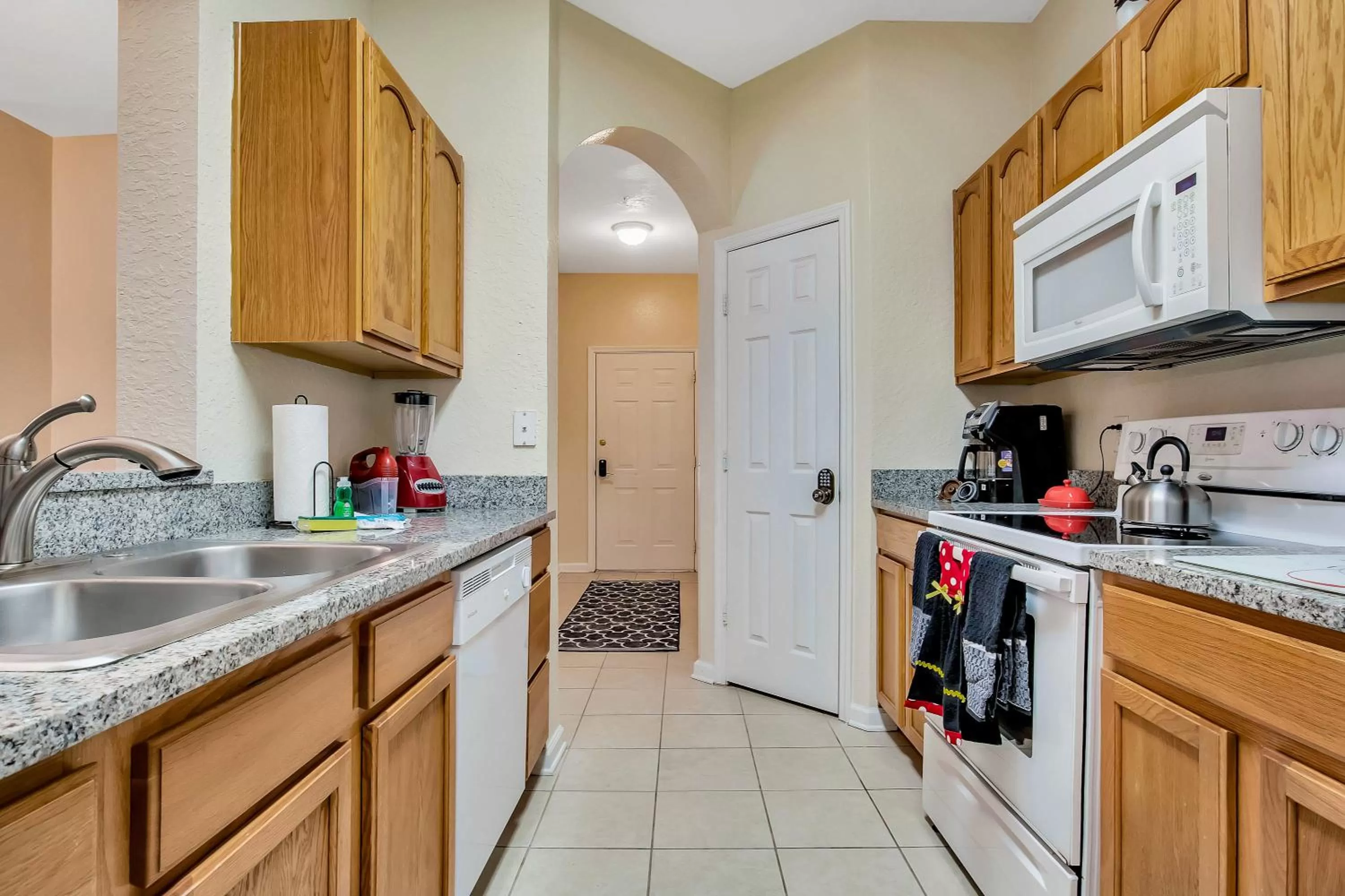 kitchen in Magical Adventure Condo w Waterpark near Disney No Resort Fees