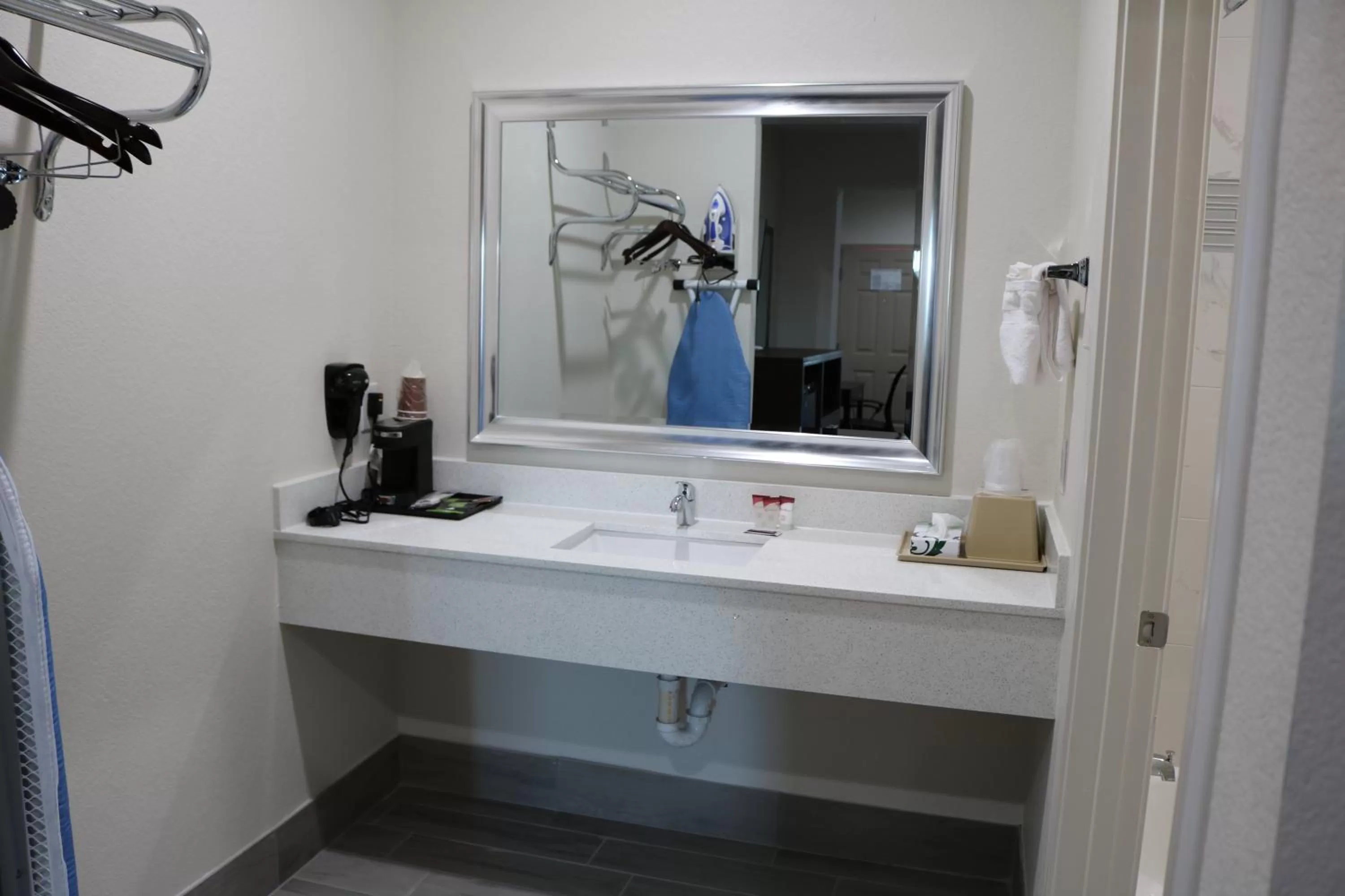 Bathroom in Scottish Inn & Suites - IAH Airport
