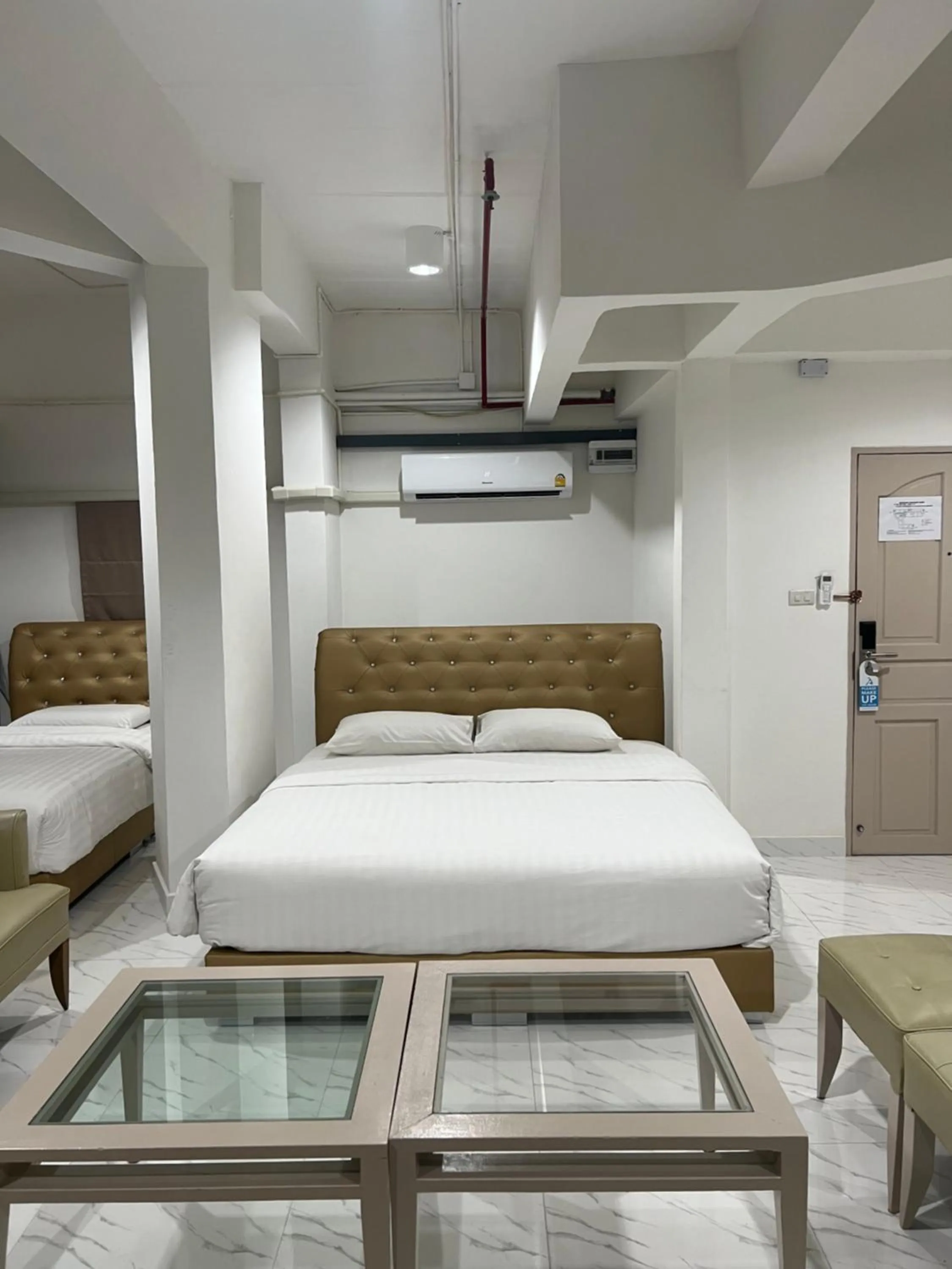 Bed in Mall Suites Hotel