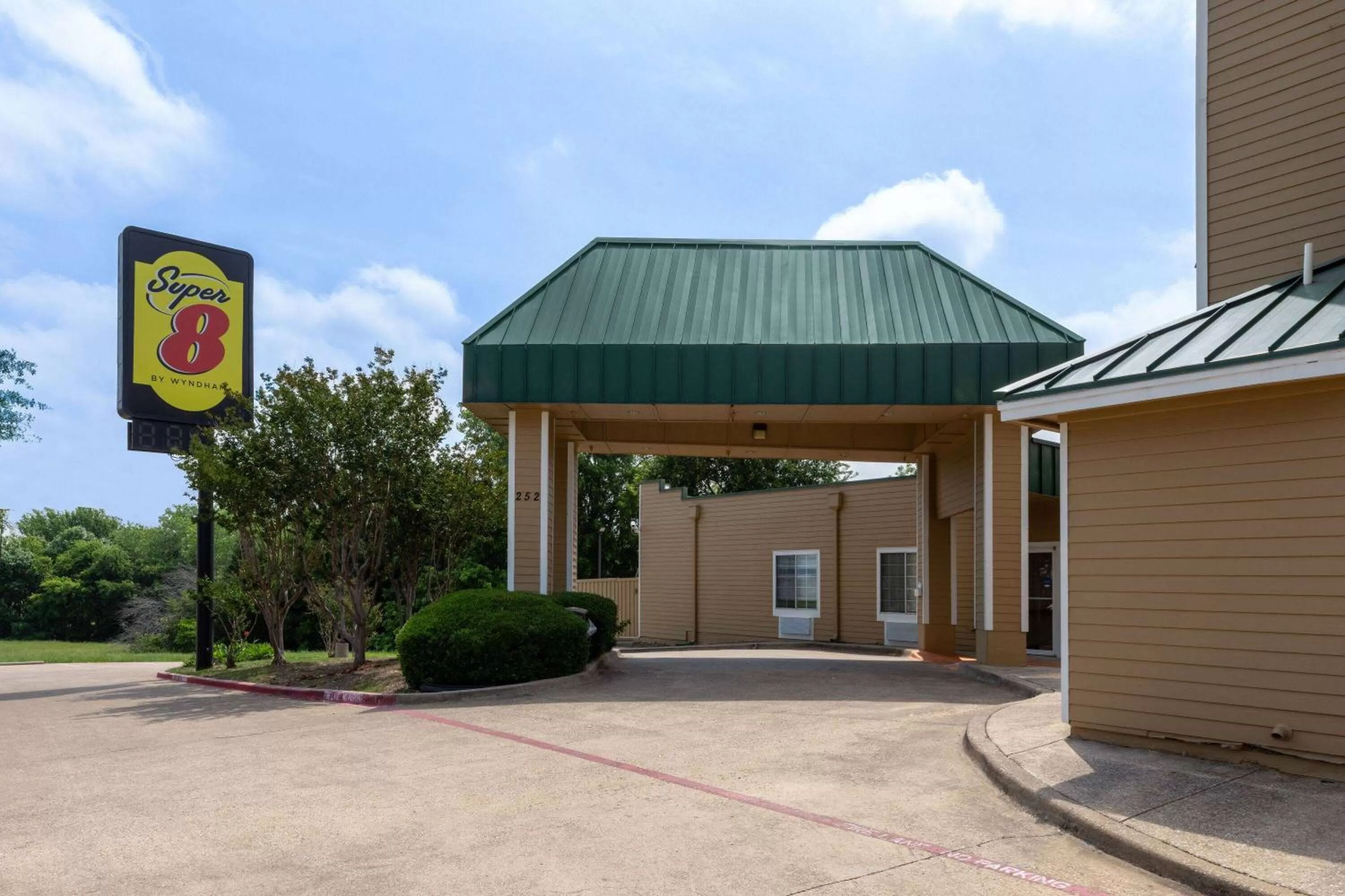 Property building in Super 8 by Wyndham Garland Rowlett East Dallas Area