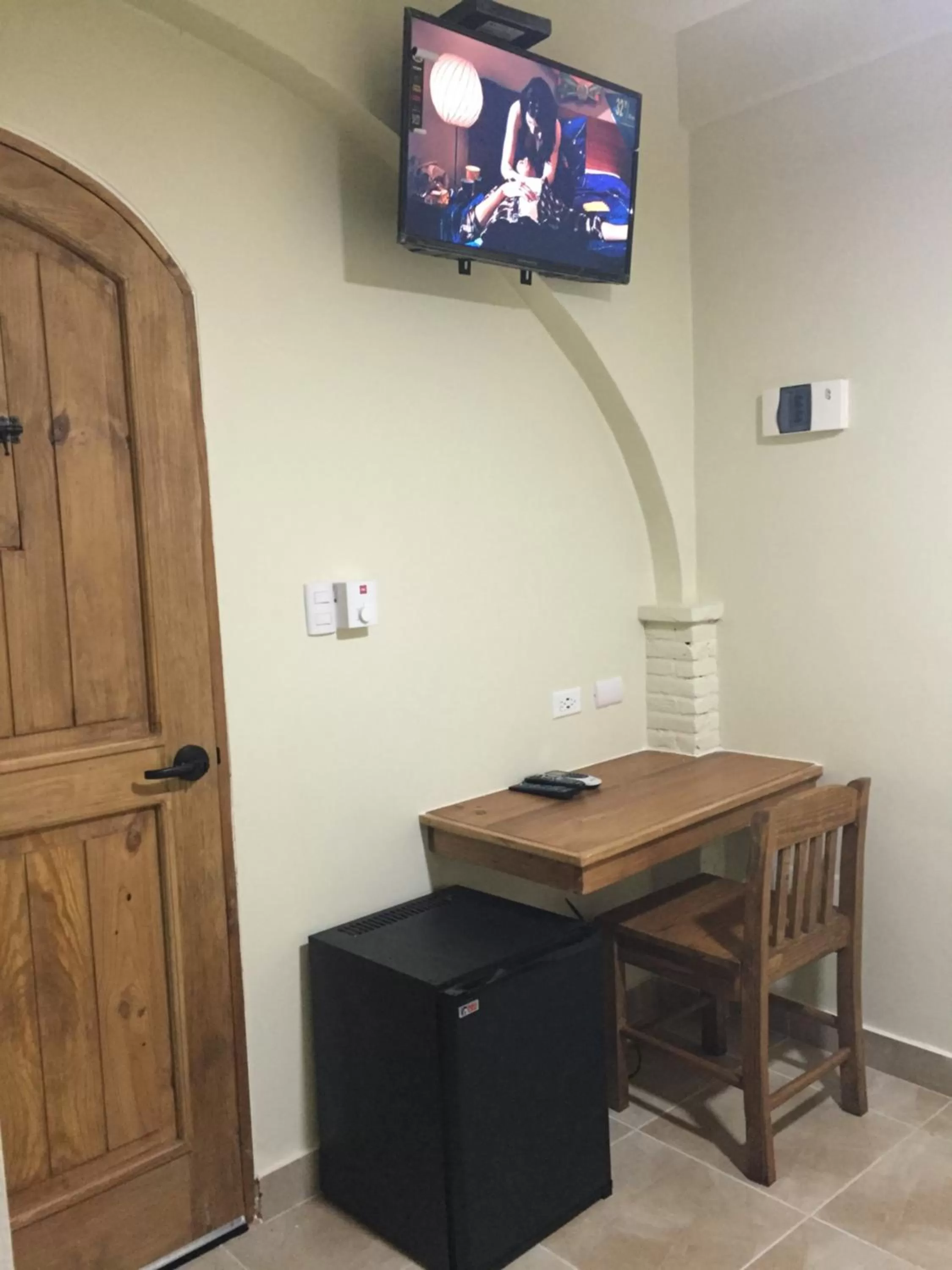 Photo of the whole room, TV/Entertainment Center in Hotel Yamilí