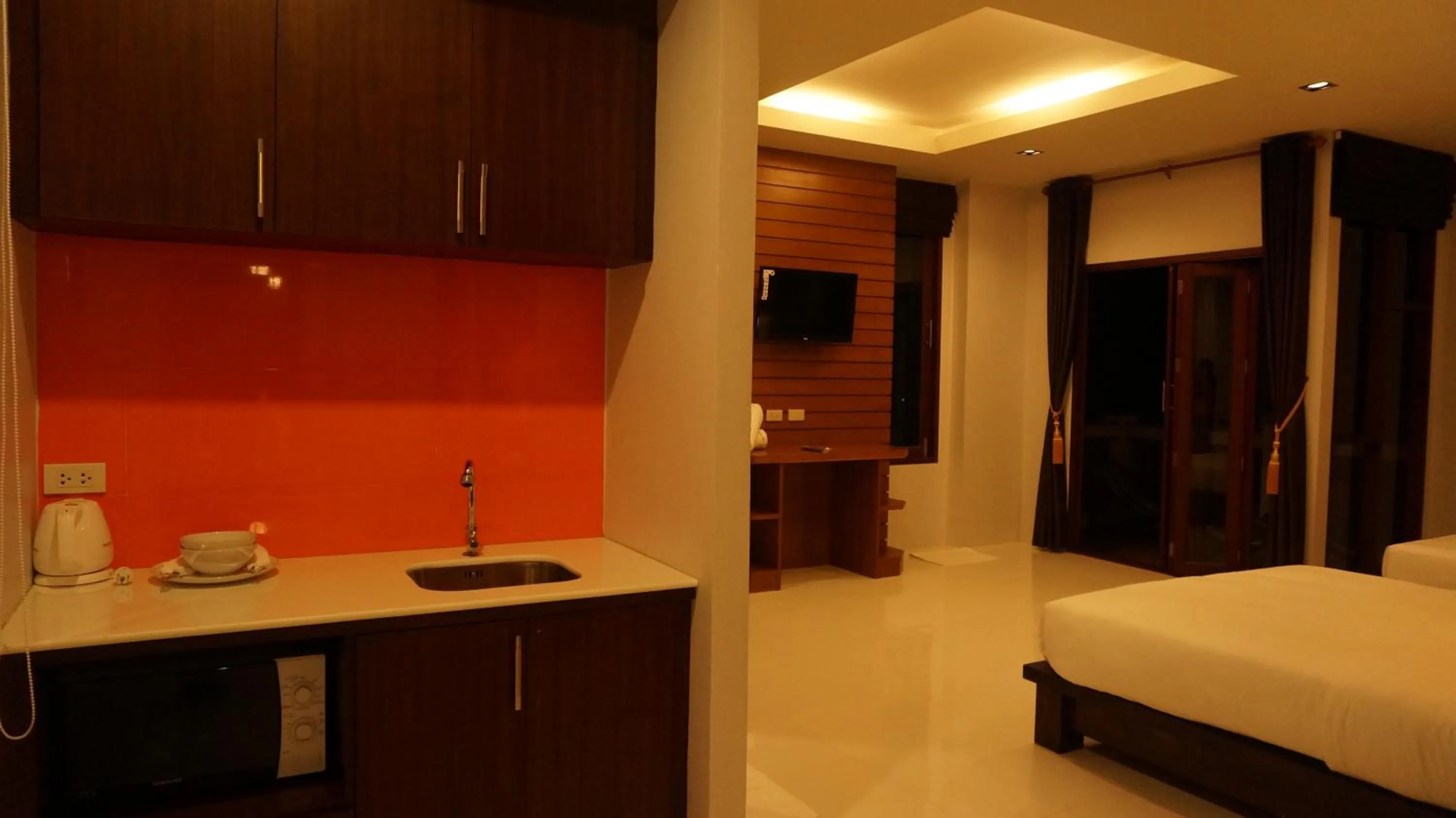 Kitchen or kitchenette, Bed in Lanta Intanin Resort - SHA Extra Plus